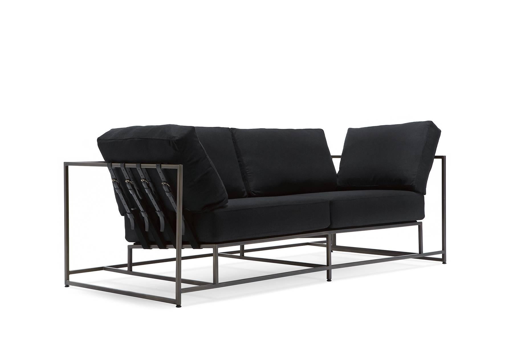 The Inheritance Two Seat Sofa by Stephen Kenn is as comfortable as it is unique. The design features an exposed construction composed of three elements - a steel frame, plush upholstery, and supportive belts. The deep seating area is perfect for a