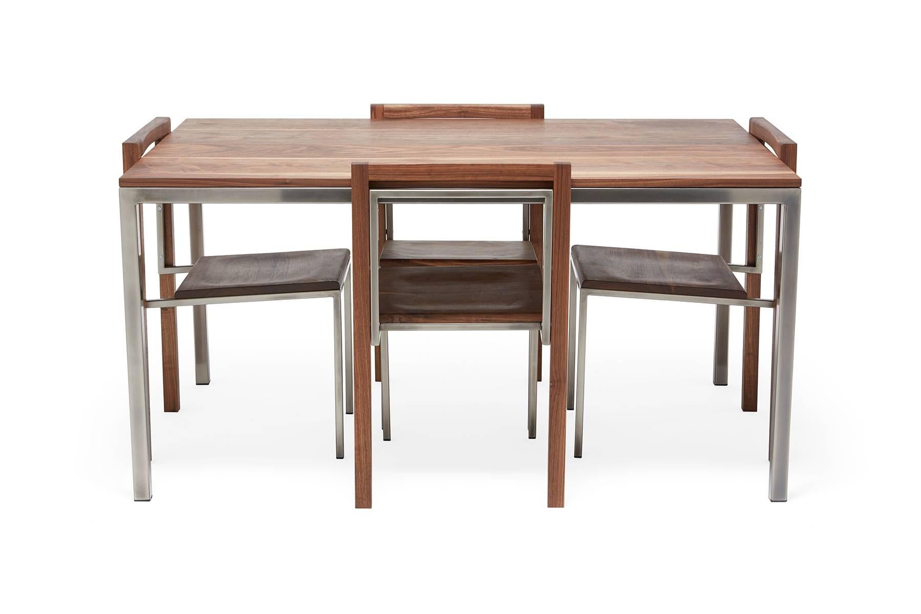 Dining goods are one of the newest additions to Stephen Kenn's The Inheritance collection. A solid walnut and steel dining table with simple and modern lines, with a set of four matching chairs.

This item is made to order in Los