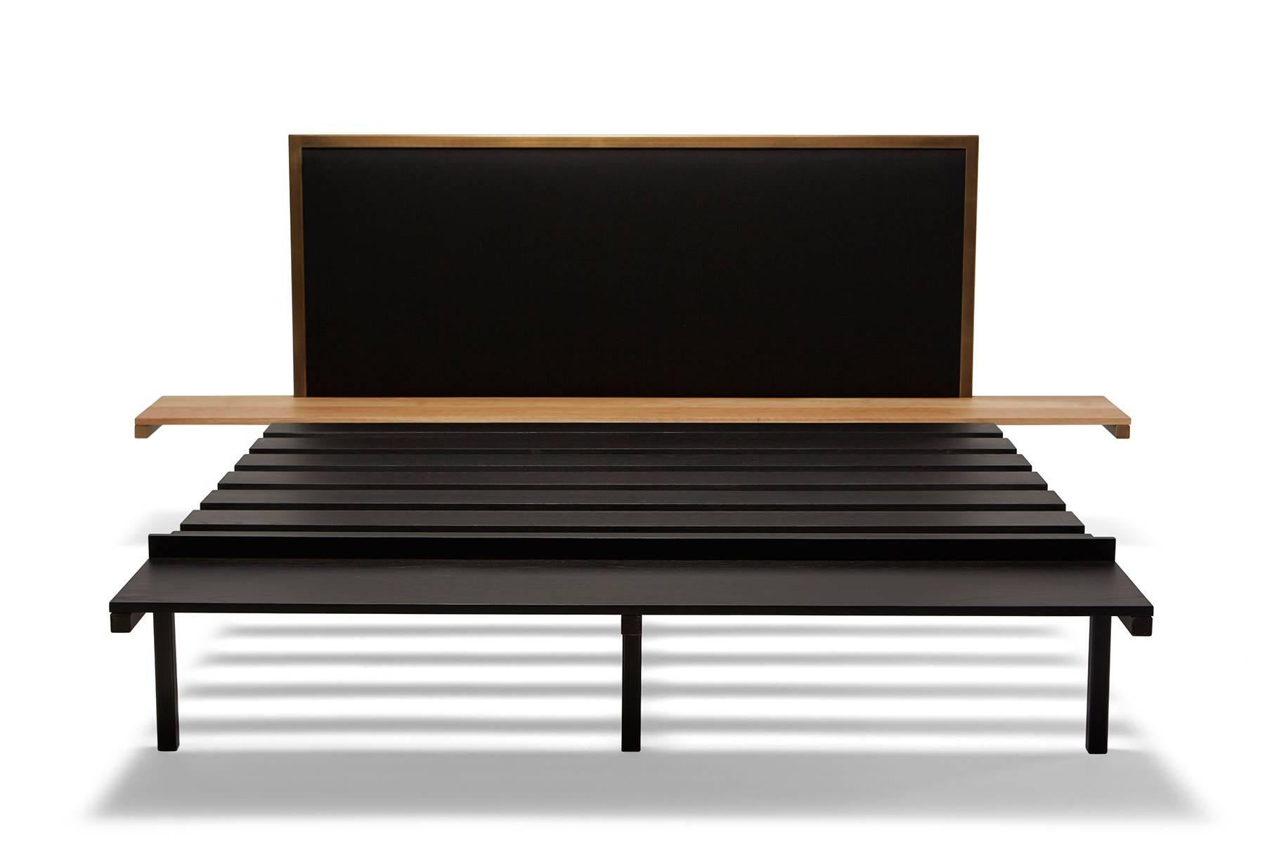 New for Stephen Kenn in 2016 is the Inheritance bed. The frame is tube steel in blackened steel and brass, with a charcoal wool headboard and oak and ebonized oak side table and bench. The side tables and bench are integrated into the frame of the