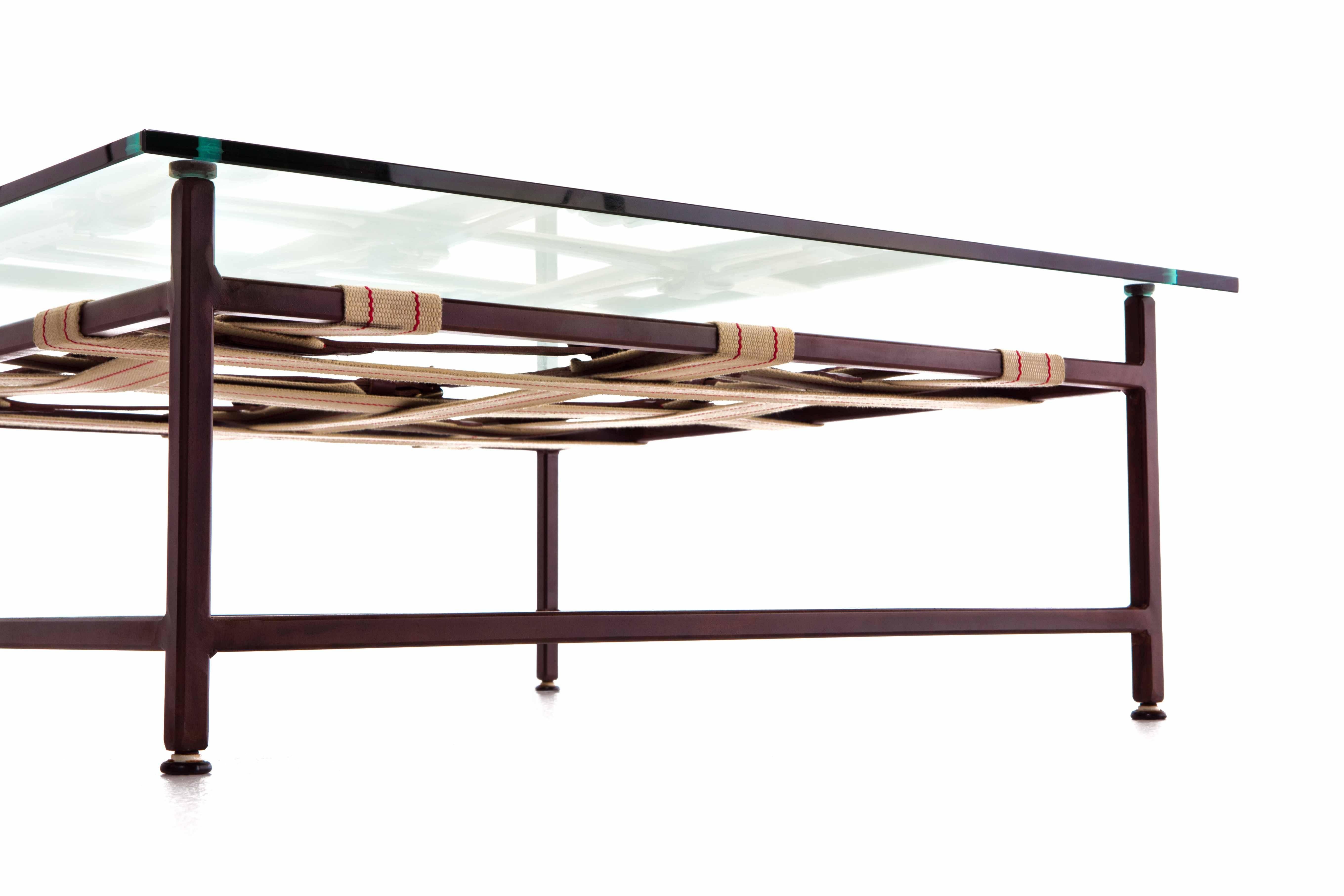 Modern Glass and Marbled Rust Coffee Table with Swiss Military and Oxblood Belts For Sale