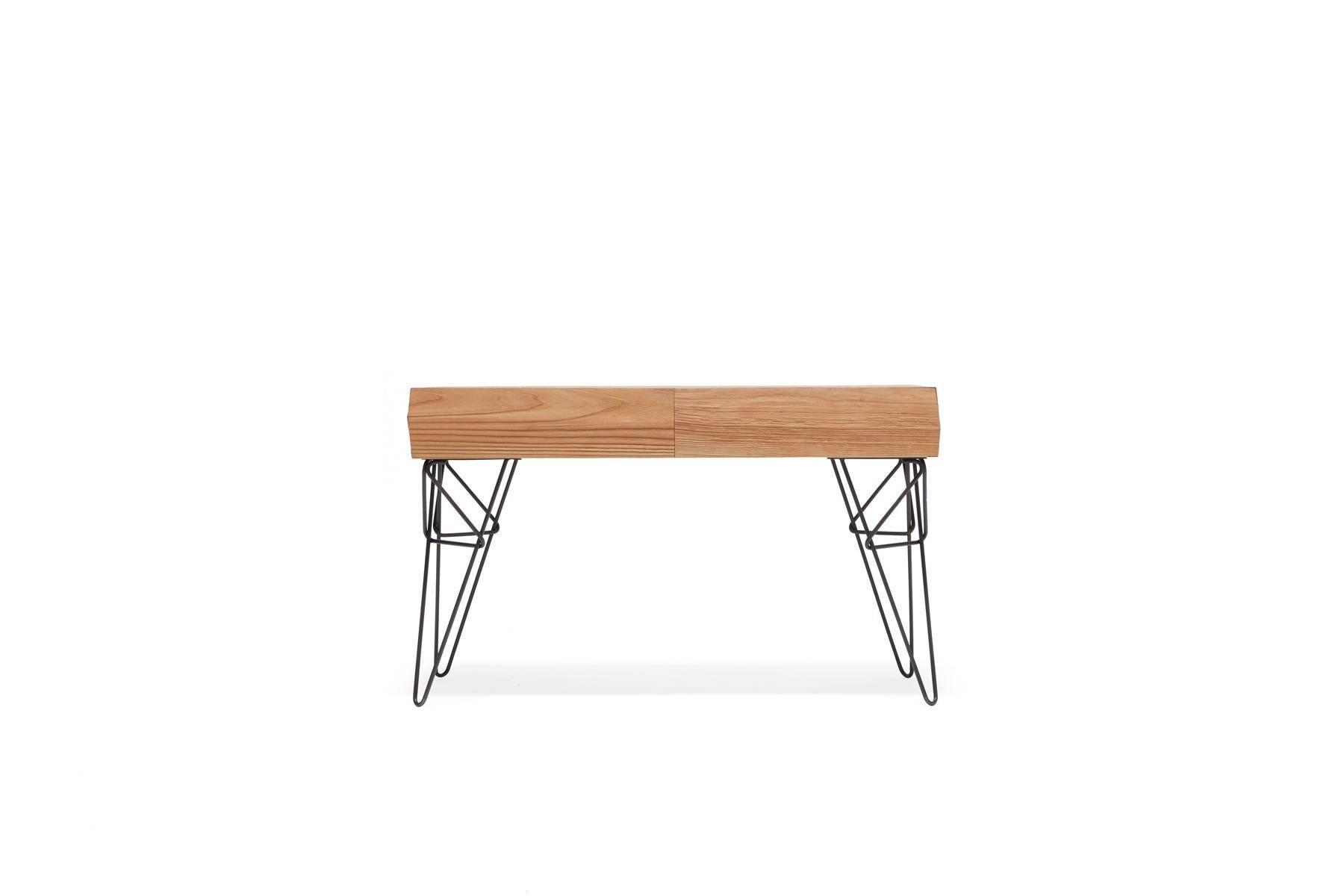 Sandblasted alder wood to simulate the effect that water and sand have on driftwood, paired with black hairpin legs in a unique design. The table has two hidden drawers to allow for out-of-sight storage.

 