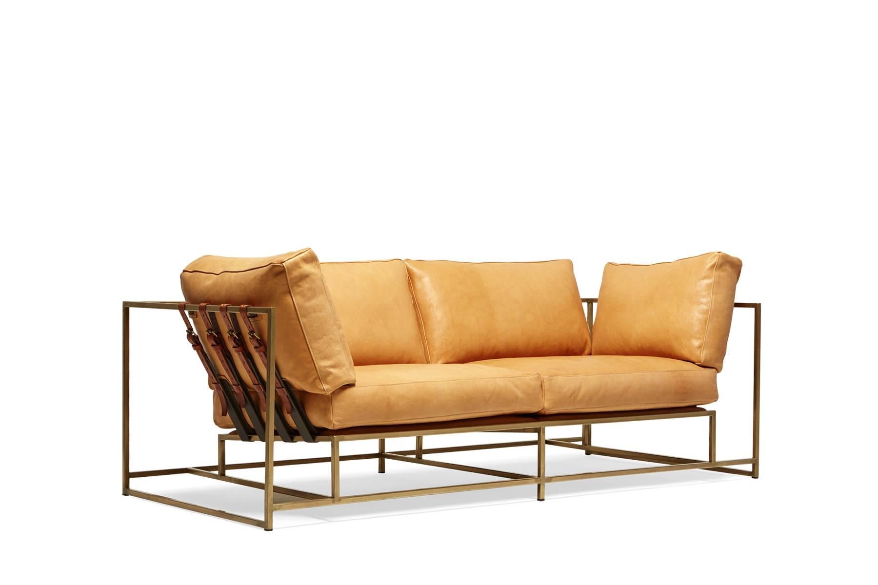 The Inheritance Two Seat Sofa by Stephen Kenn is as comfortable as it is unique. The design features an exposed construction composed of three elements - a steel frame, plush upholstery, and supportive belts. The deep seating area is perfect for a