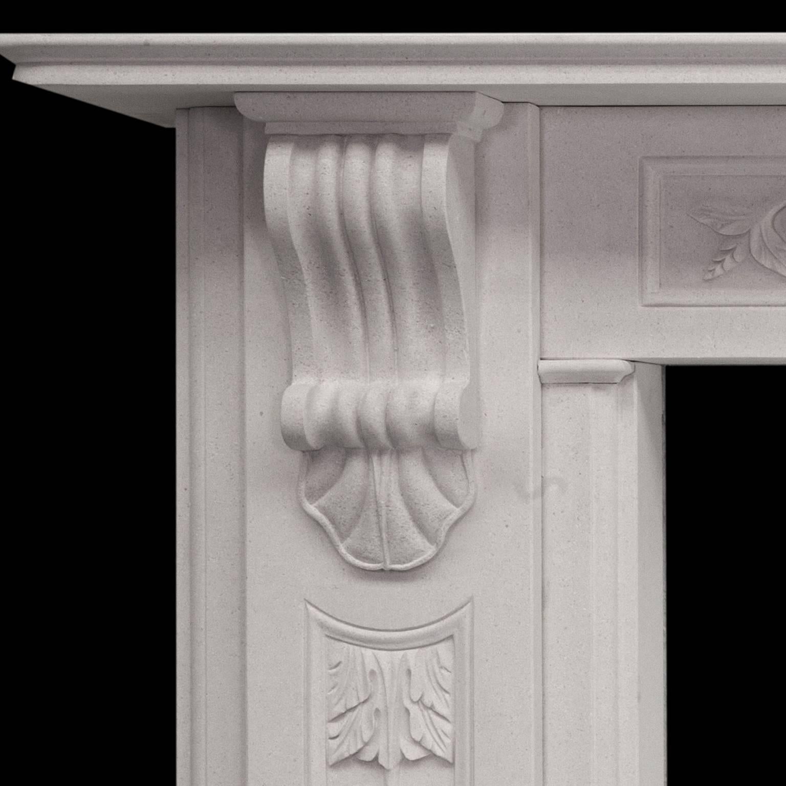 An impressive large English made white limestone fireplace mantel.
Hand-carved corbels, with detailed recessed panels and acanthus leaf carvings on jamb and frieze.