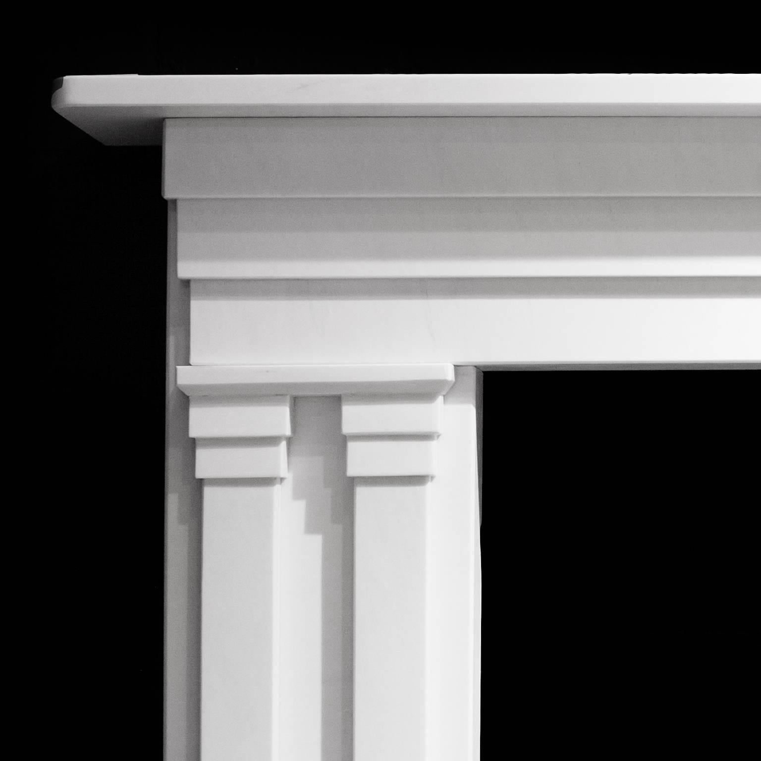 A very nice white honed marble fireplace. English made.
Late Georgian / Early Victorian design. Caved in Italian statuary marble. With double columns and Paneled Frieze. Measures: 63 inch wide x 45.5 inch high x 8.25 inch deep.