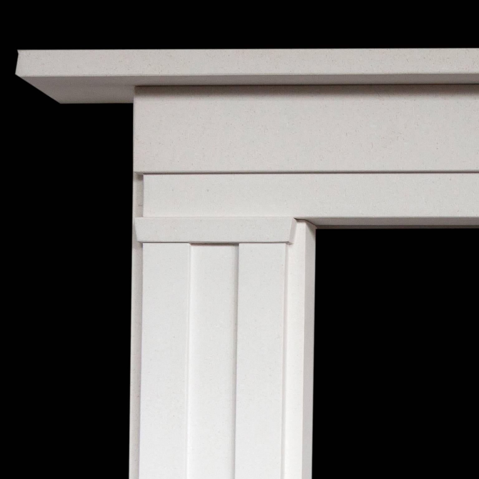 English made stone fireplace mantel. Made from a light Turkish limestone with a honed finish. Hand-carved with impressive columns giving a contemporary feel.
 