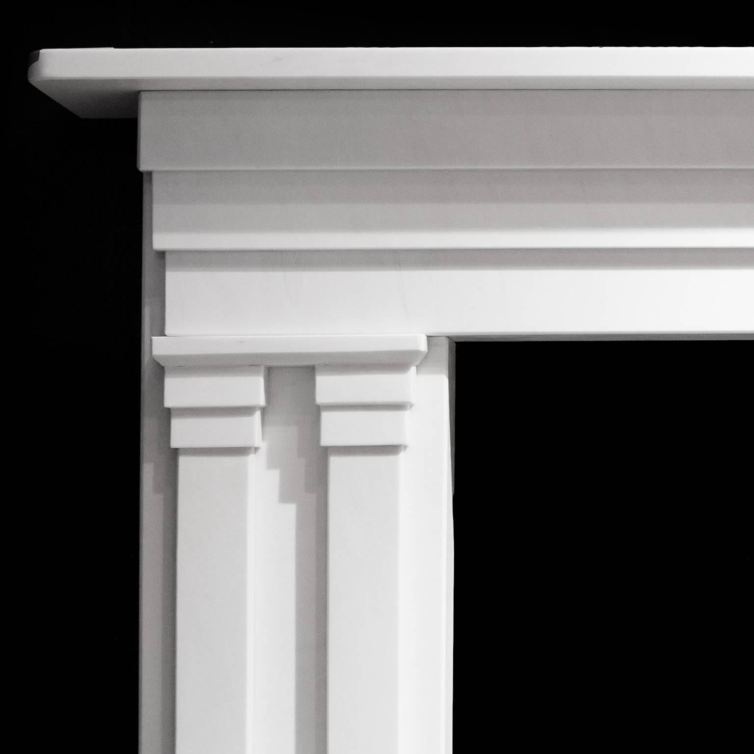 Late Georgian, early Victorian style English made fireplace mantel.
English made with impressive white limestone.
Hand-carved with columns giving an elegant understated appearance.