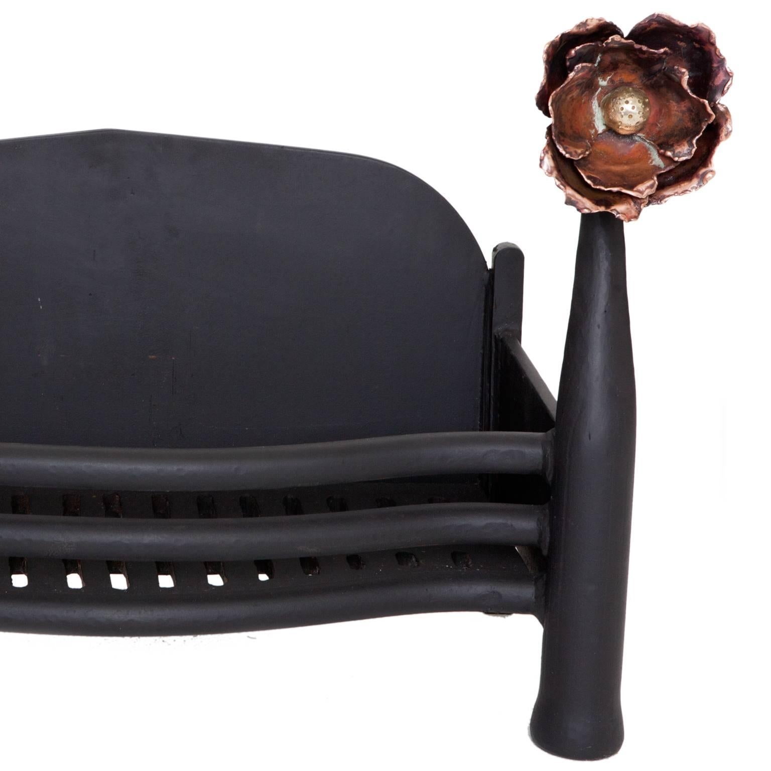 English cast-iron fire basket with copper and brass tulip heads on the fire dogs. Very unusual art nouveau basket example.
