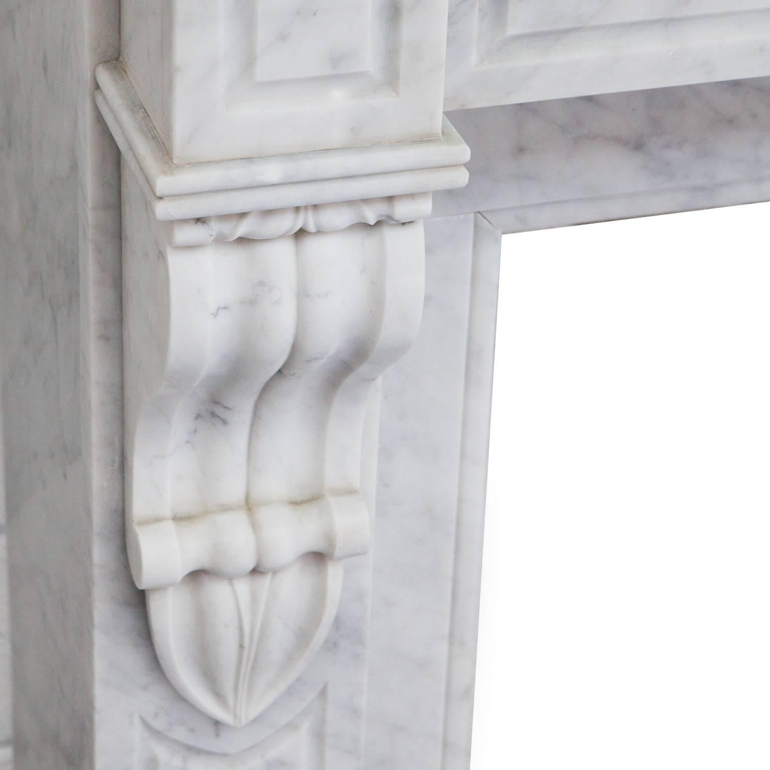 Unique Rare 19th century antique French Louis Phillipe Fireplace Mantel. Hand-carved in desirable Italian Carrara marble. Recessed panelled jambs and frieze with carved centre circle and elegantly carved corbels.

Full measurements:
Shelf width