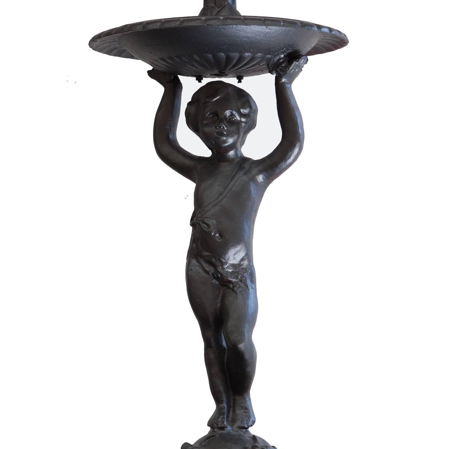 Vintage black cast iron two-tier cherub dolphin reclaimed fountain.
This is a wonderful Victorian style two tier fountain. There are three Dolphins surrounding the base and a cherub as its centre piece.
Taken from an English manor house and