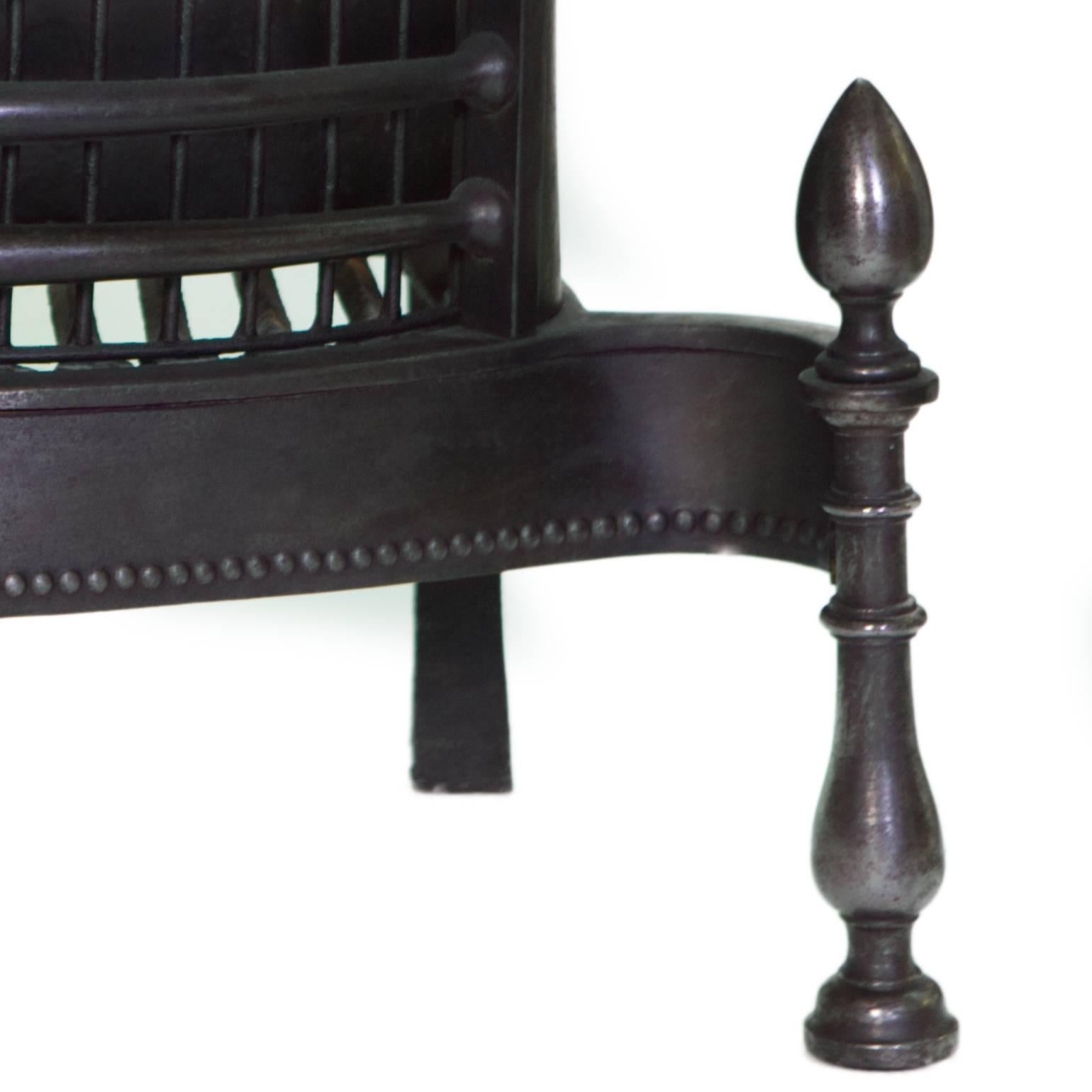 A very fine late 18th century Classic Georgian black cast iron fire basket.
With simple detail to the fire back, steel apron and cast finials.
Salvaged and restored from a London Town House.  

Measure: Back width 19 1/2