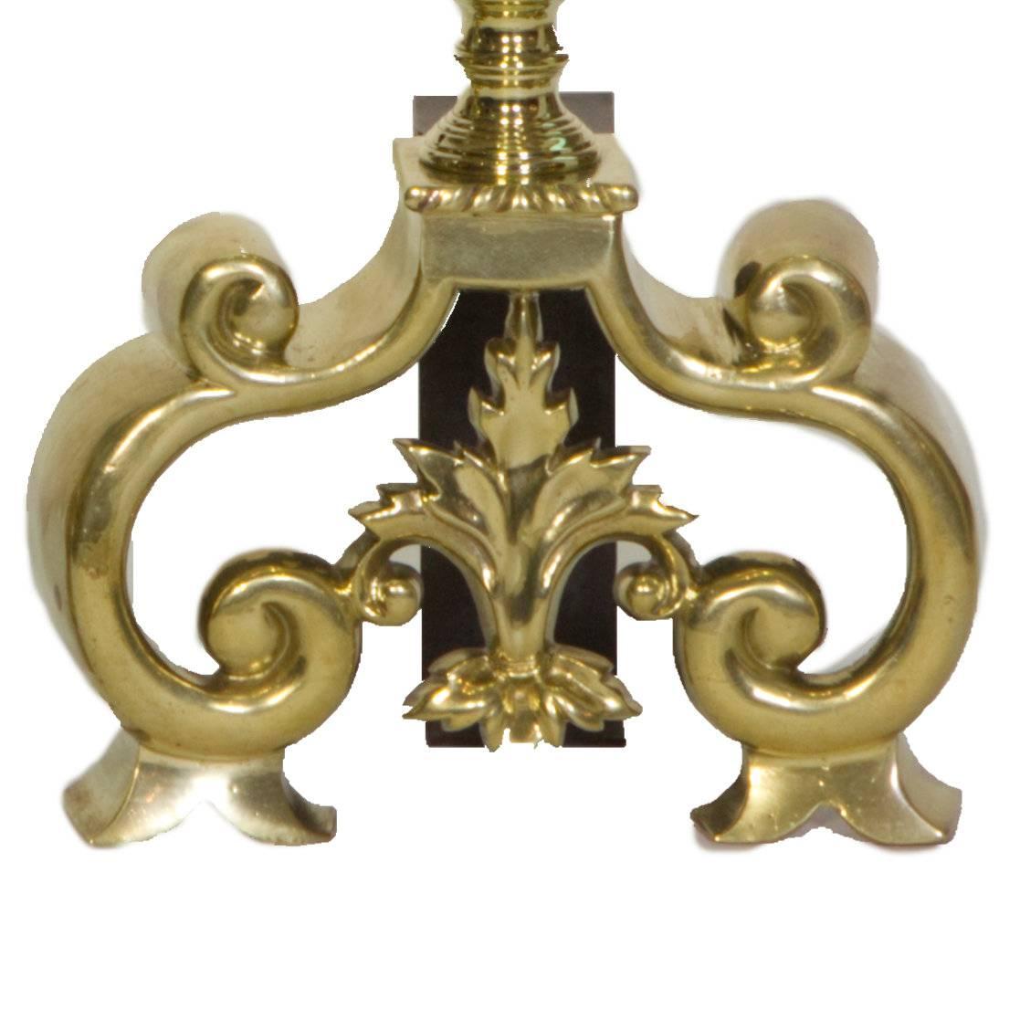 Pair of antique detailed cast brass andirons, fire dogs.
With pierced globes and flame-burst finials.

Measures: Height 18