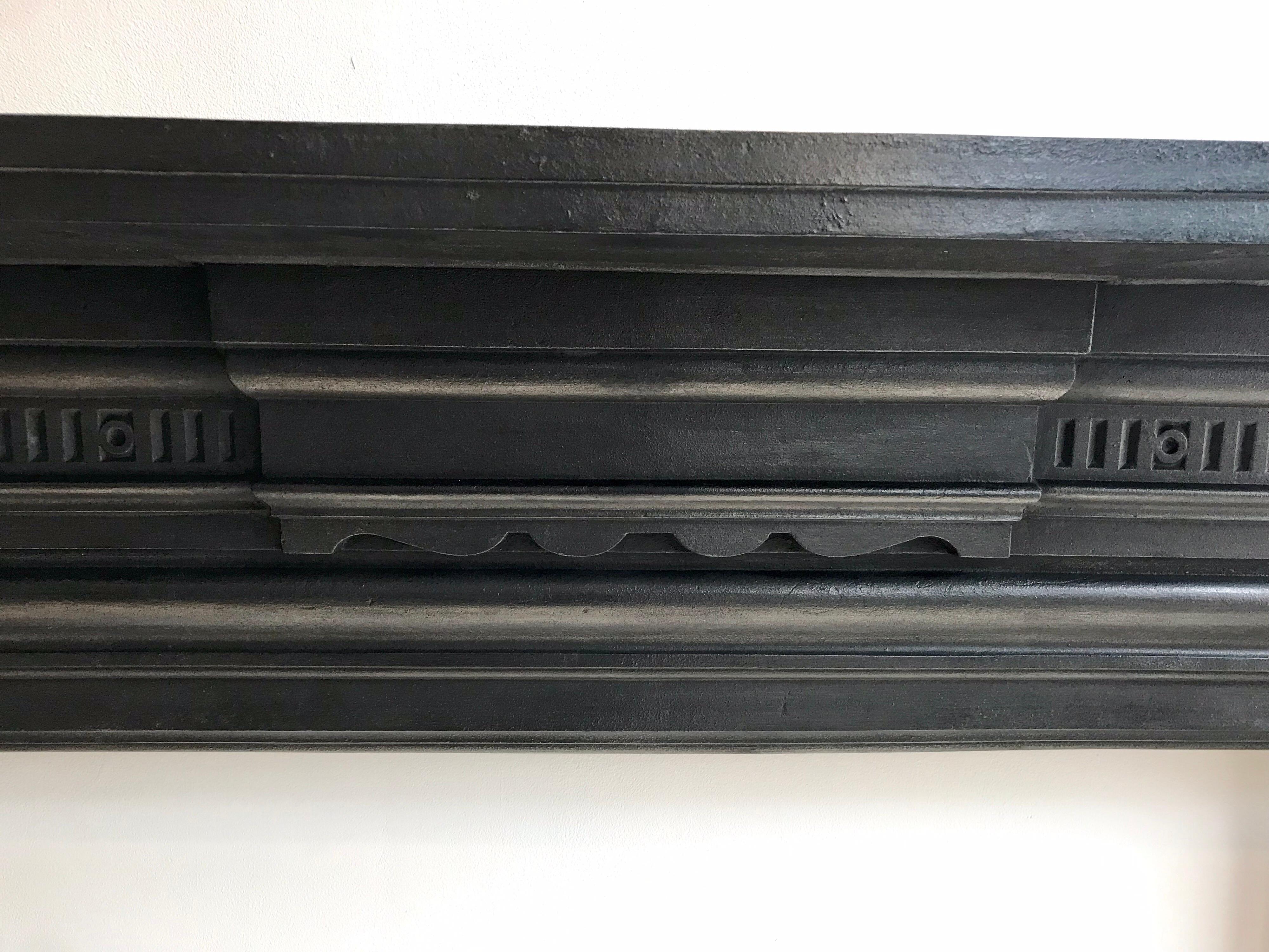 An original British Victorian antique cast iron fireplace mantelpiece.
Recently salvaged from a London Town House.
Nice simple cast iron design with traditional blackened finish.