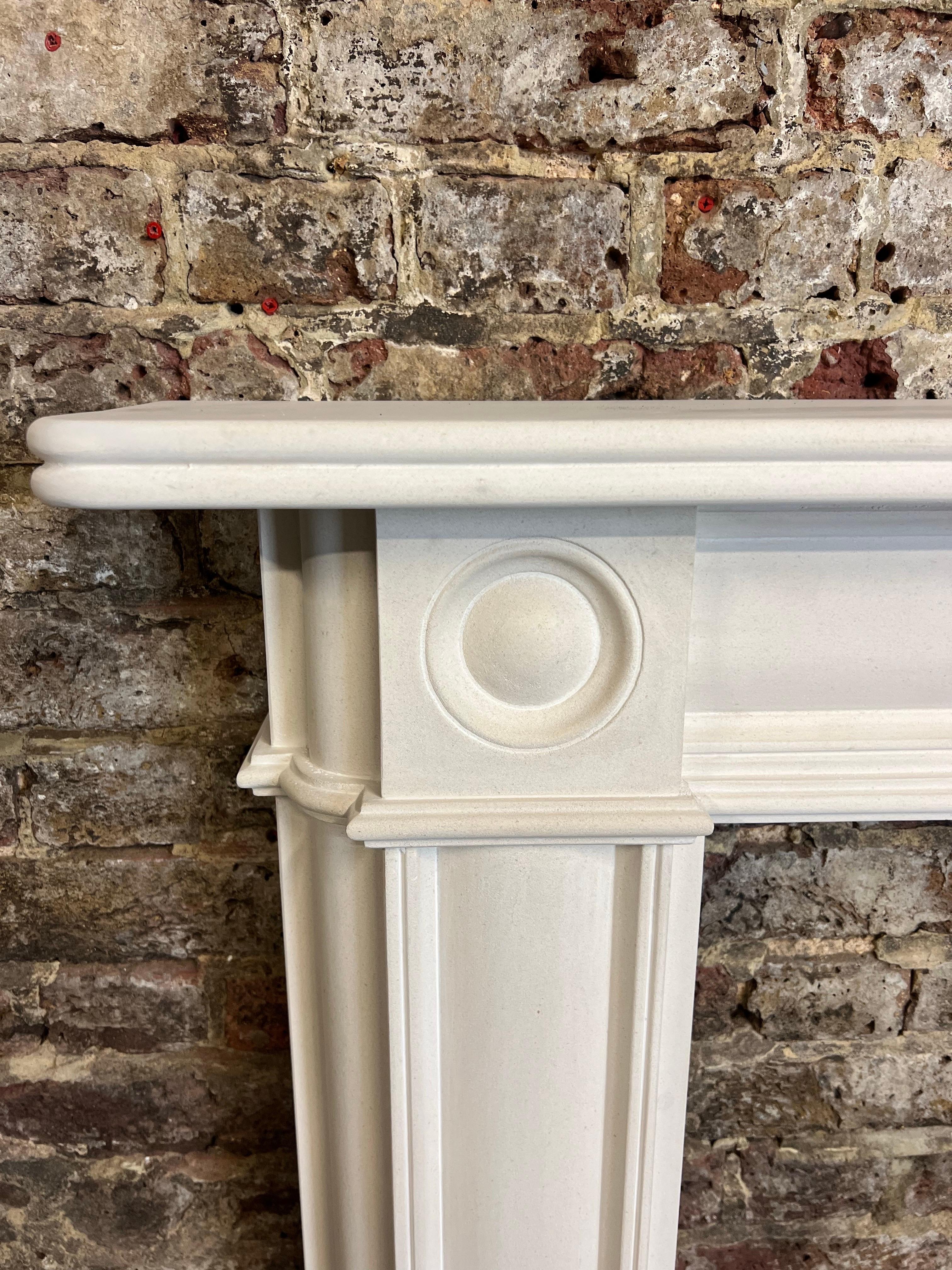 Hand-Carved 20th Century Bullseye Limestone Fireplace Mantlepiece For Sale