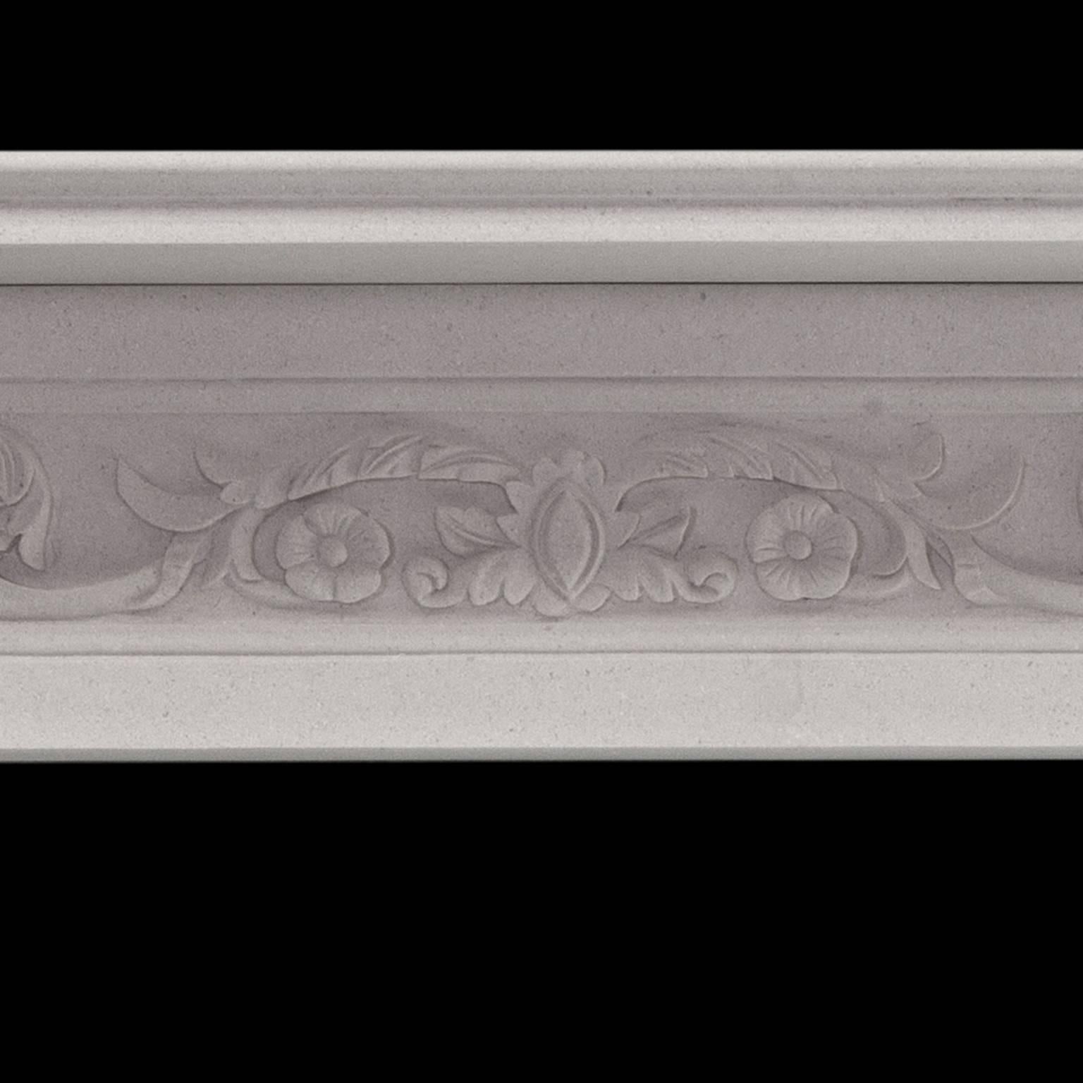 An impressive English made white Italian stone fireplace mantel.
Hand-carved corbels with detailed recessed panels on jambs and frieze.