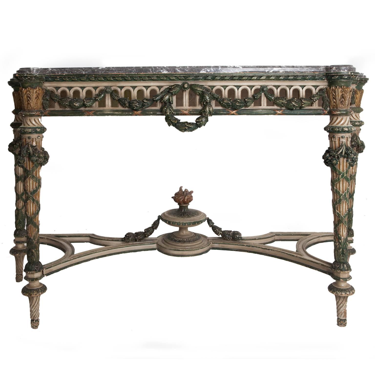 Late 19th century Italian console table. Painted and parcel-gilt with pierced frieze on fluted stretched supports with St Anne’s veined grey marble top. Taken from an English manor house.
 