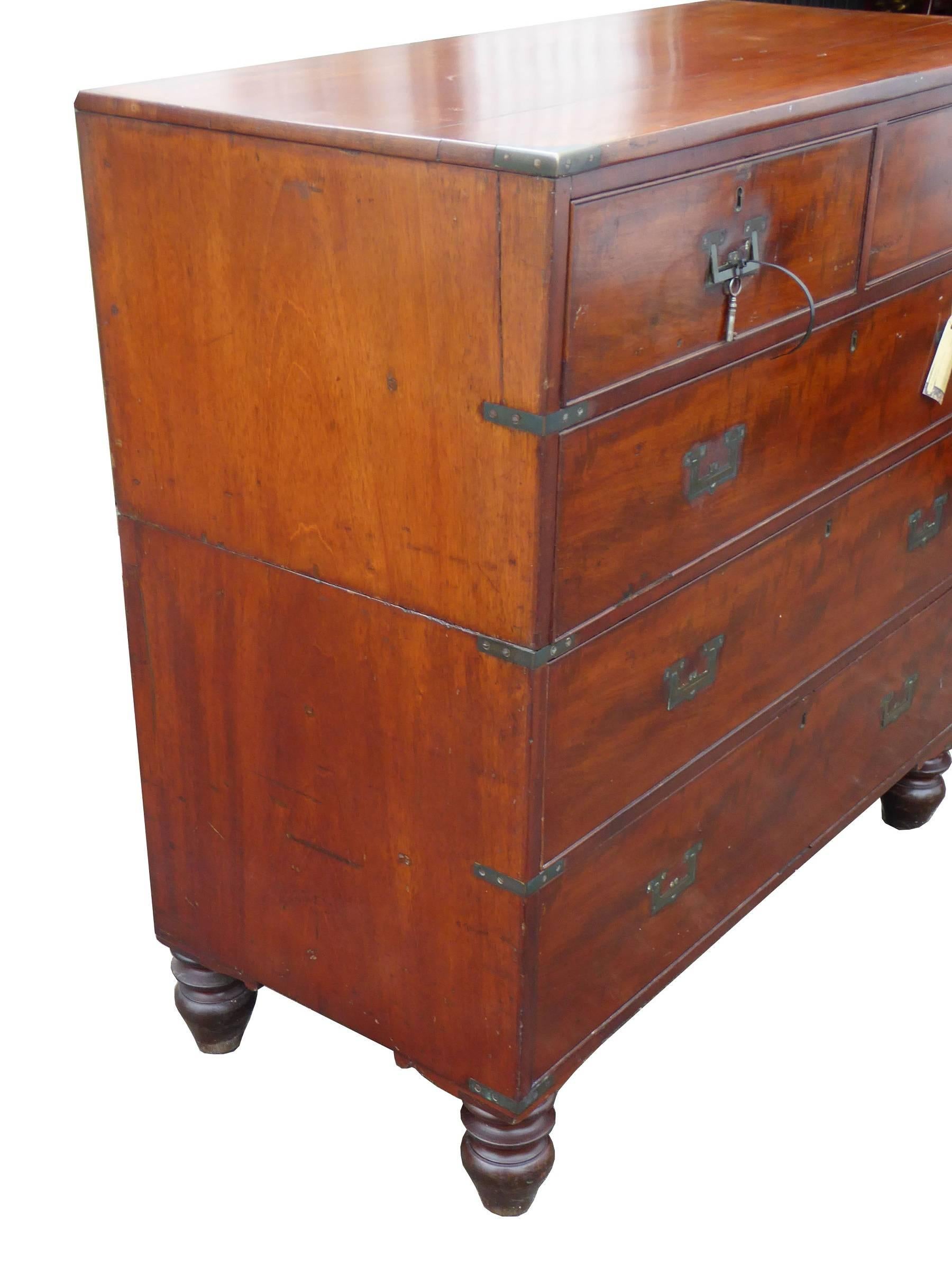 For sale is a good quality George III mahogany campaign chest. The chest splits into two halves and has its original brass handles, locks etc. complete with original key. The piece stands on nicely turned feet and is in good condition with slight
