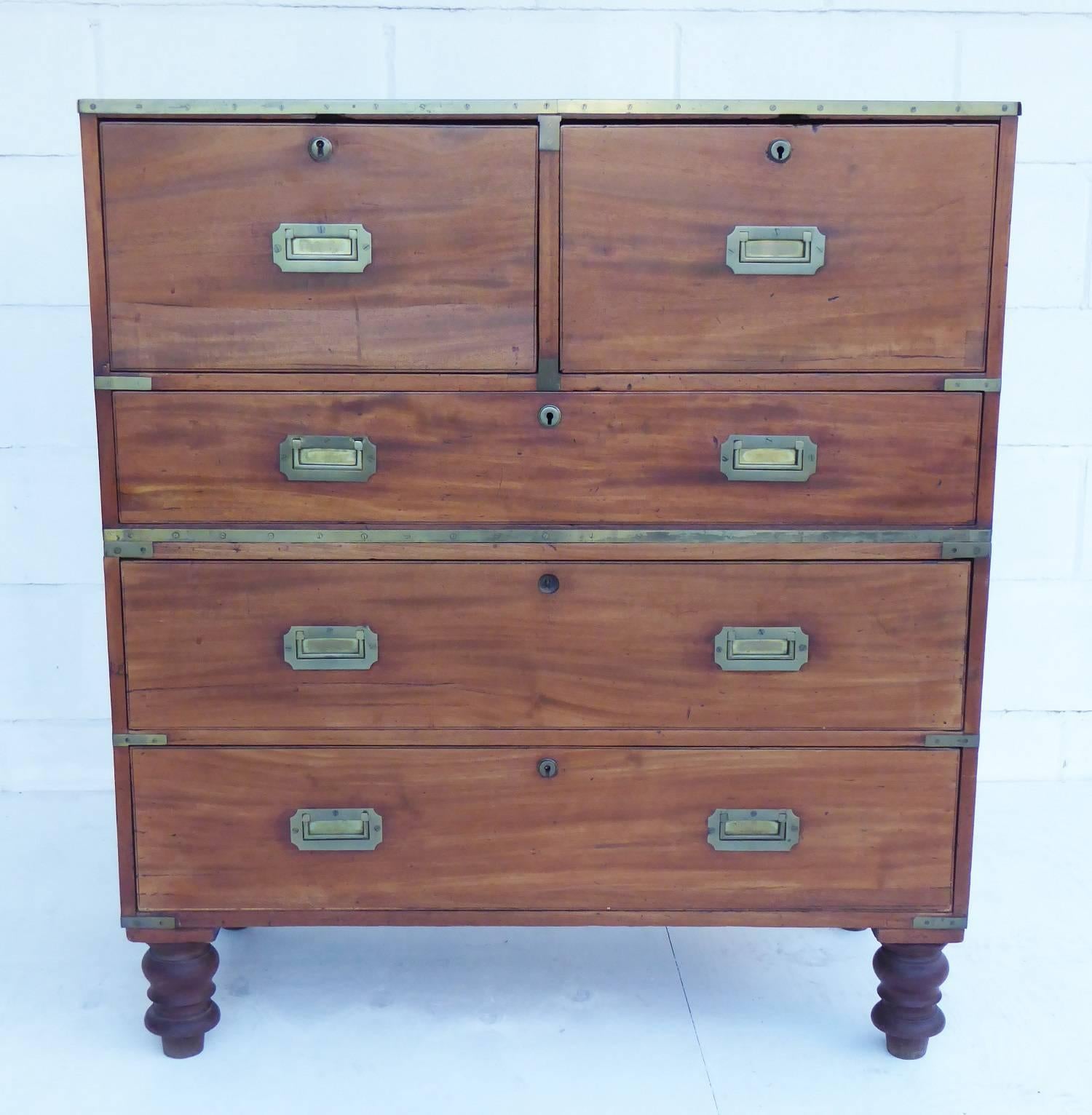 For sale is a good quality 19th century Mahogany Campaign Chest. The top half of the chest has two large drawers, above one long drawer, each with brass handles. The bottom half of the chest has a further two long drawers with matching brass