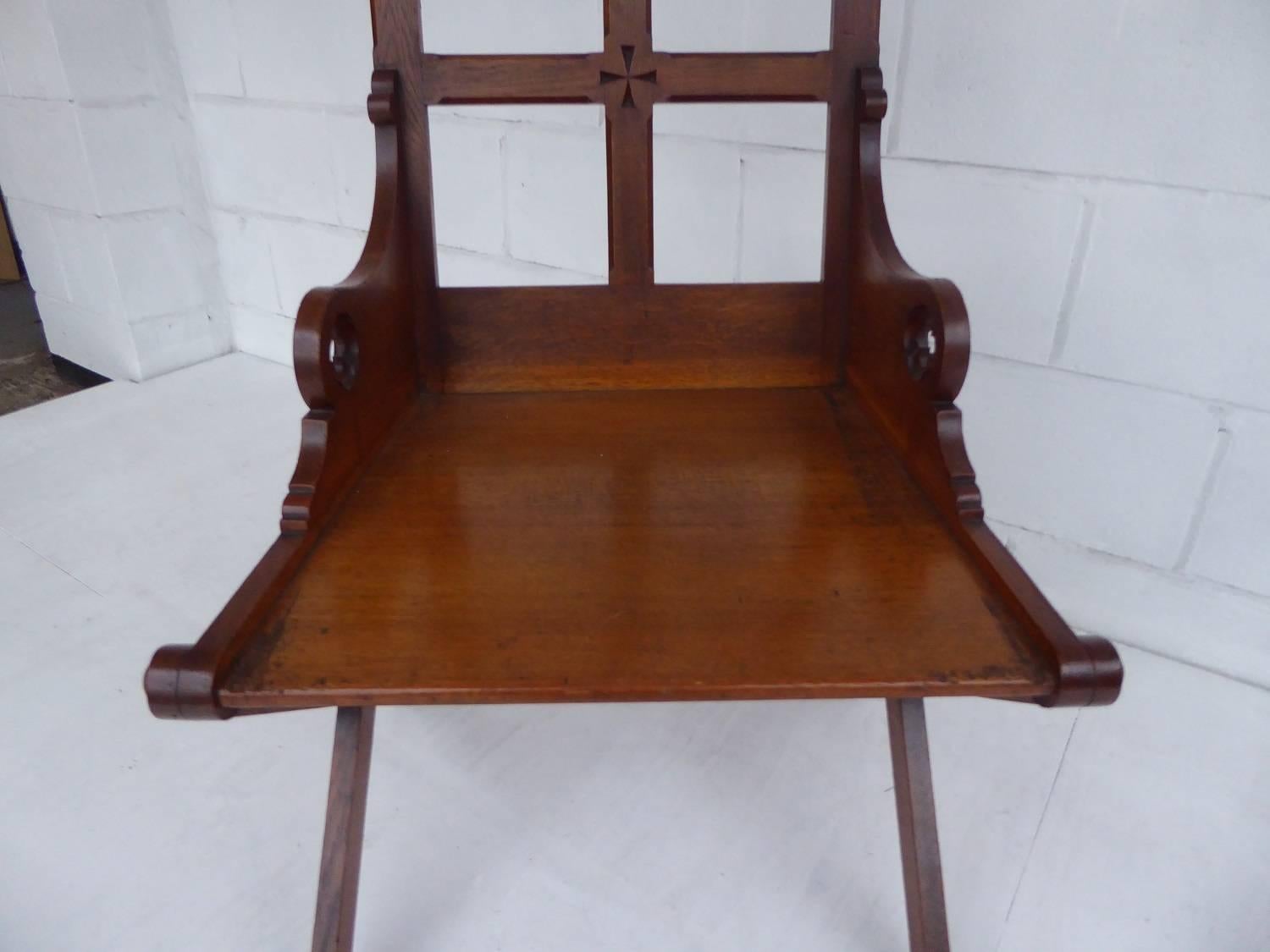 For sale is a good quality 19th century solid oak Gothic revival armchair. The chair is in excellent, original condition.