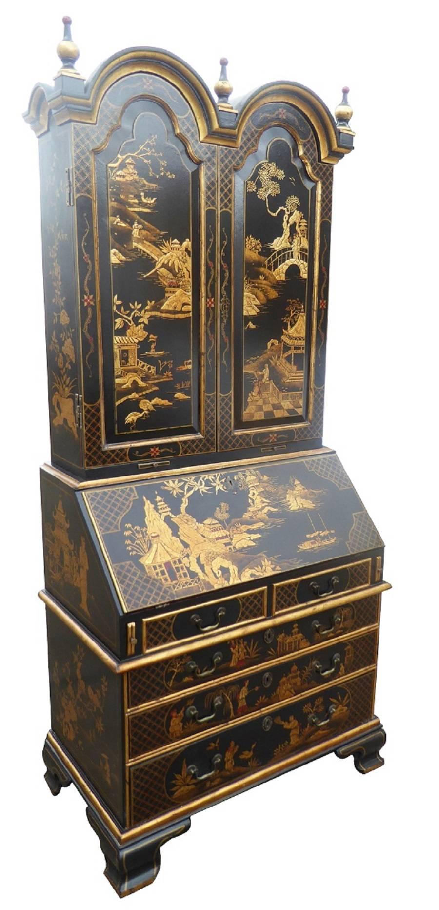 For sale is a good quality 19th century, chinoiserie and gilt decorated 20th century Bureau bookcase. The bookcase has a double dome top with decorative finials, above two paneled doors, both decorated with oriental scenes. These doors open to