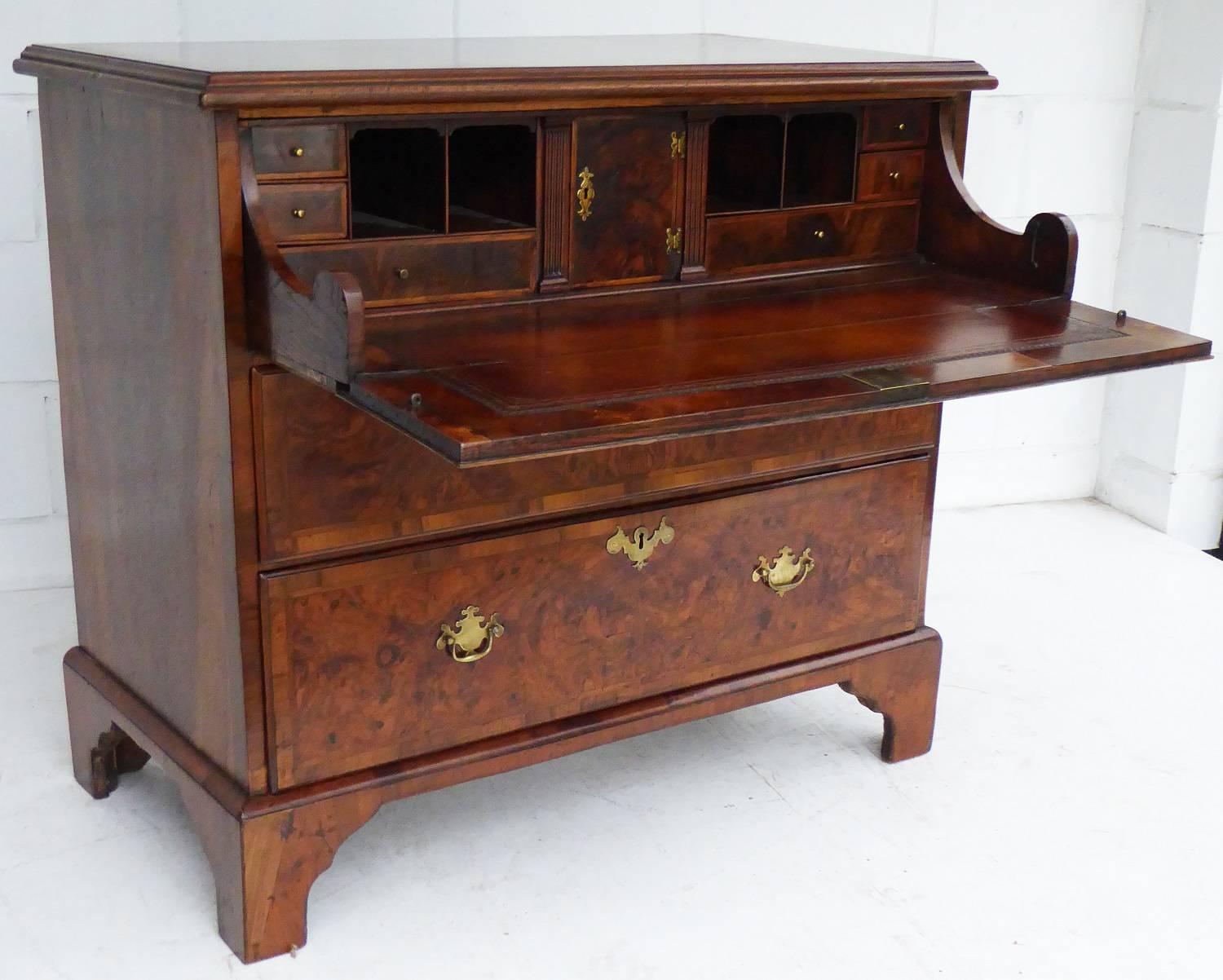 For sale is a good quality George III walnut secretaire chest. The top of the chest has nice walnut banding above three drawers. The top drawer, having a fall front, opens to reveal a fully fitted secretaire, with a hand dyed 