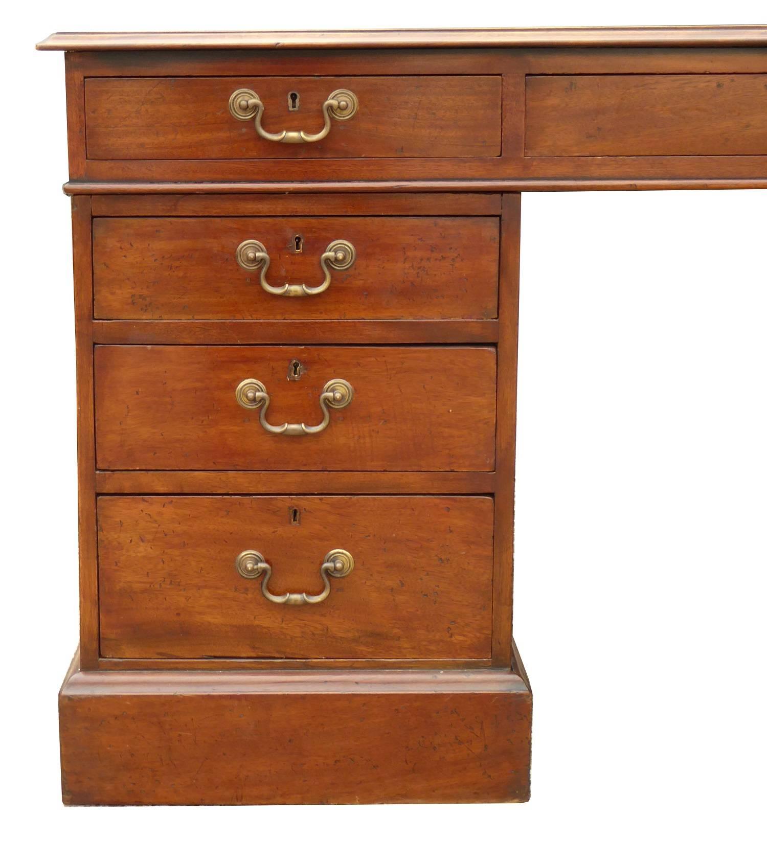 For sale is a good quality Edwardian mahogany partners desk. The top of the desk has a black leather, with decorative gold tooling. The top of the desk has three drawers on each side, one long in the centre flanked by a short drawer on either side.