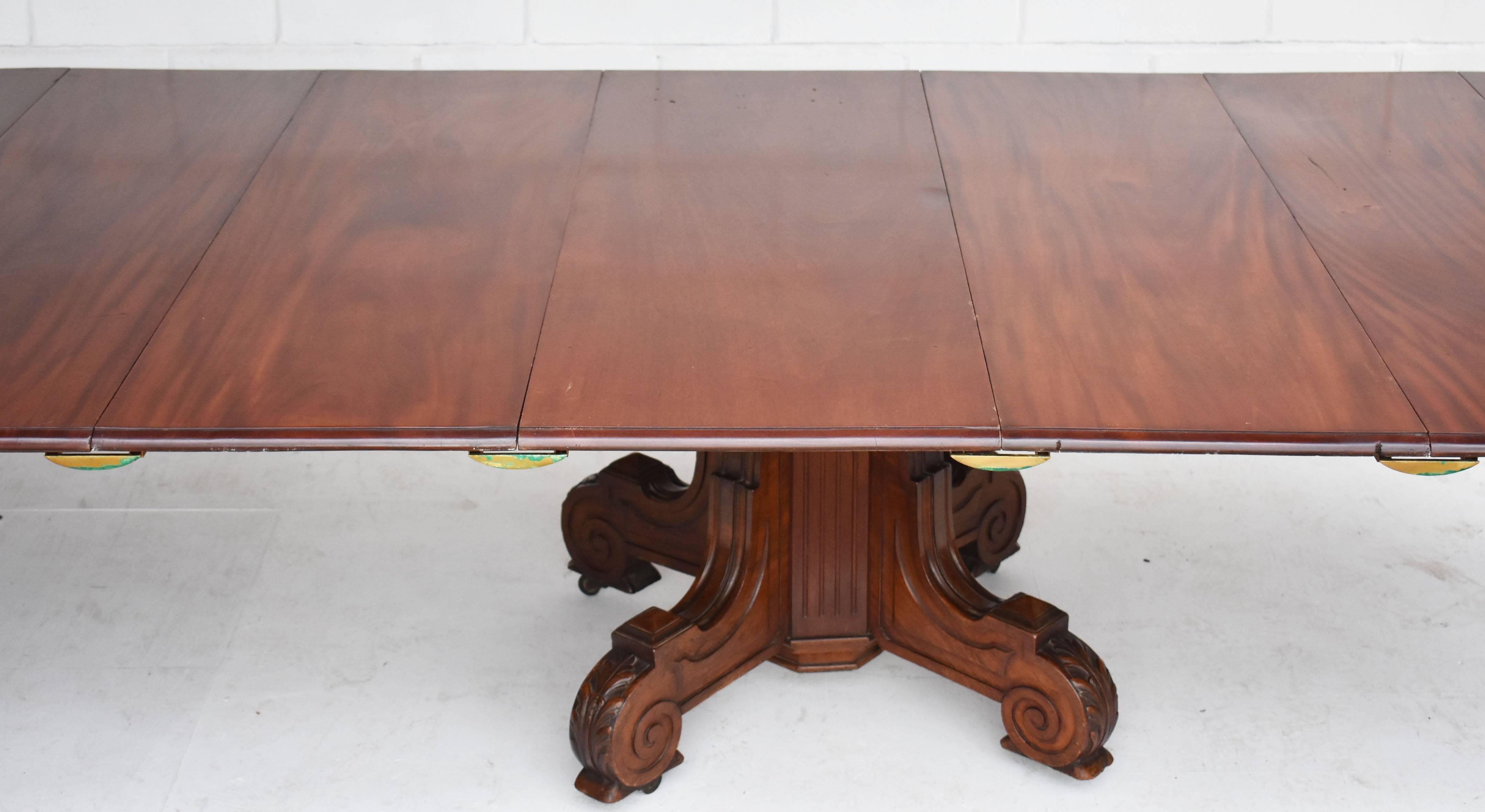 For sale is a fine quality William IV Mahogany extending dining table with five original additional leaves. When closed, the table top is round and is supported by an ornate base to the centre, with four shaped and carved legs stemming from a