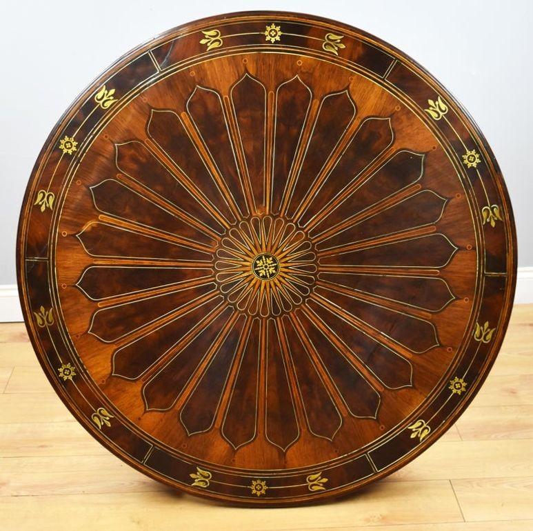 Regency Flame Mahogany & Brass Inlaid Drum Table – c.1815
Item Code: S26-647
An outstanding Regency period flame mahogany drum table of exceptional quality, adorned with intricate brass inlay. The circular top features a radiant segmented design