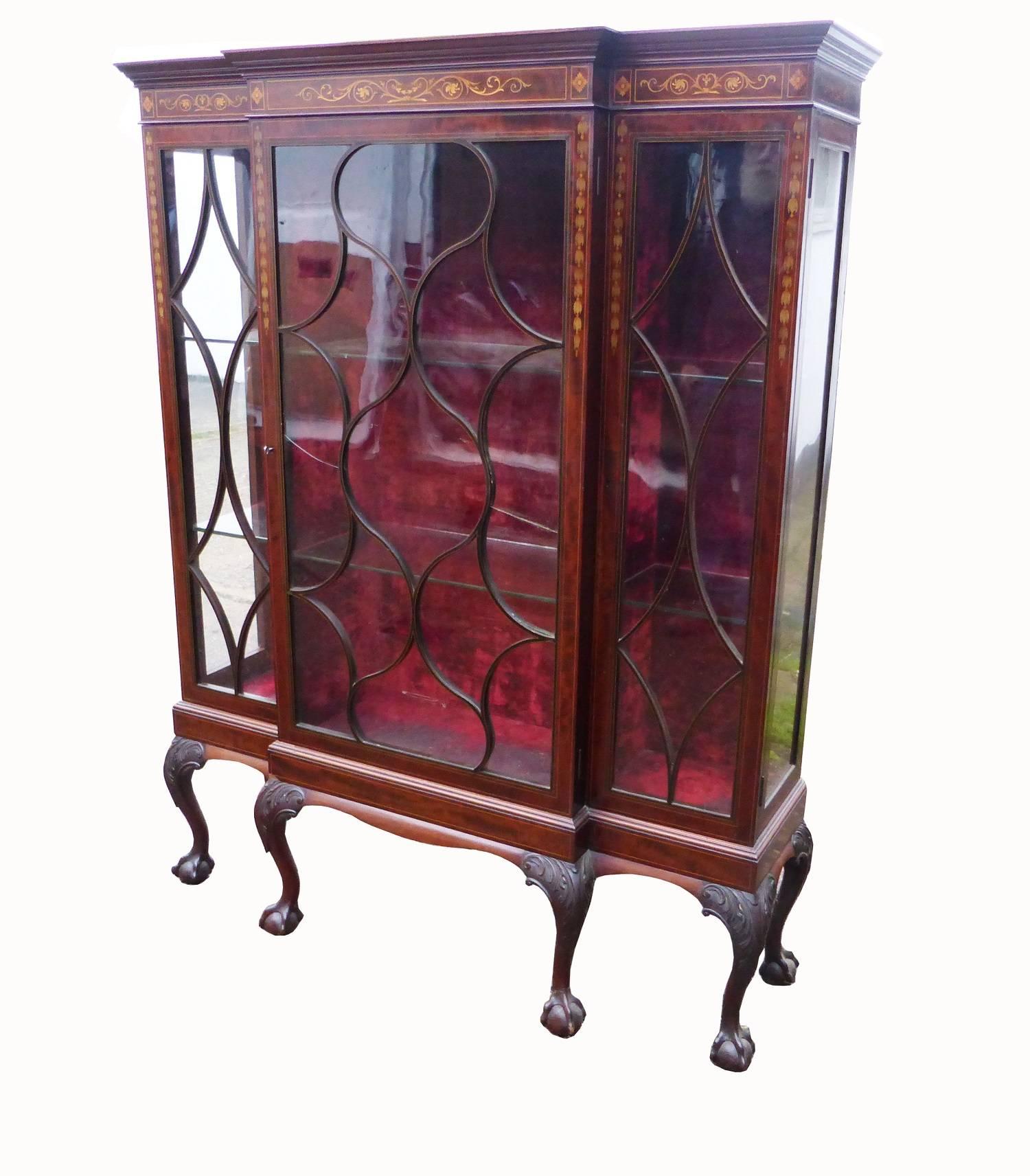 For sale is a very good quality Victorian inlaid display cabinet. The cabinet is nicely inlaid all-over, with elliptical glazed doors and sides. The interior of the cabinet is nicely lined with a velvet type material and houses two glass shelves.