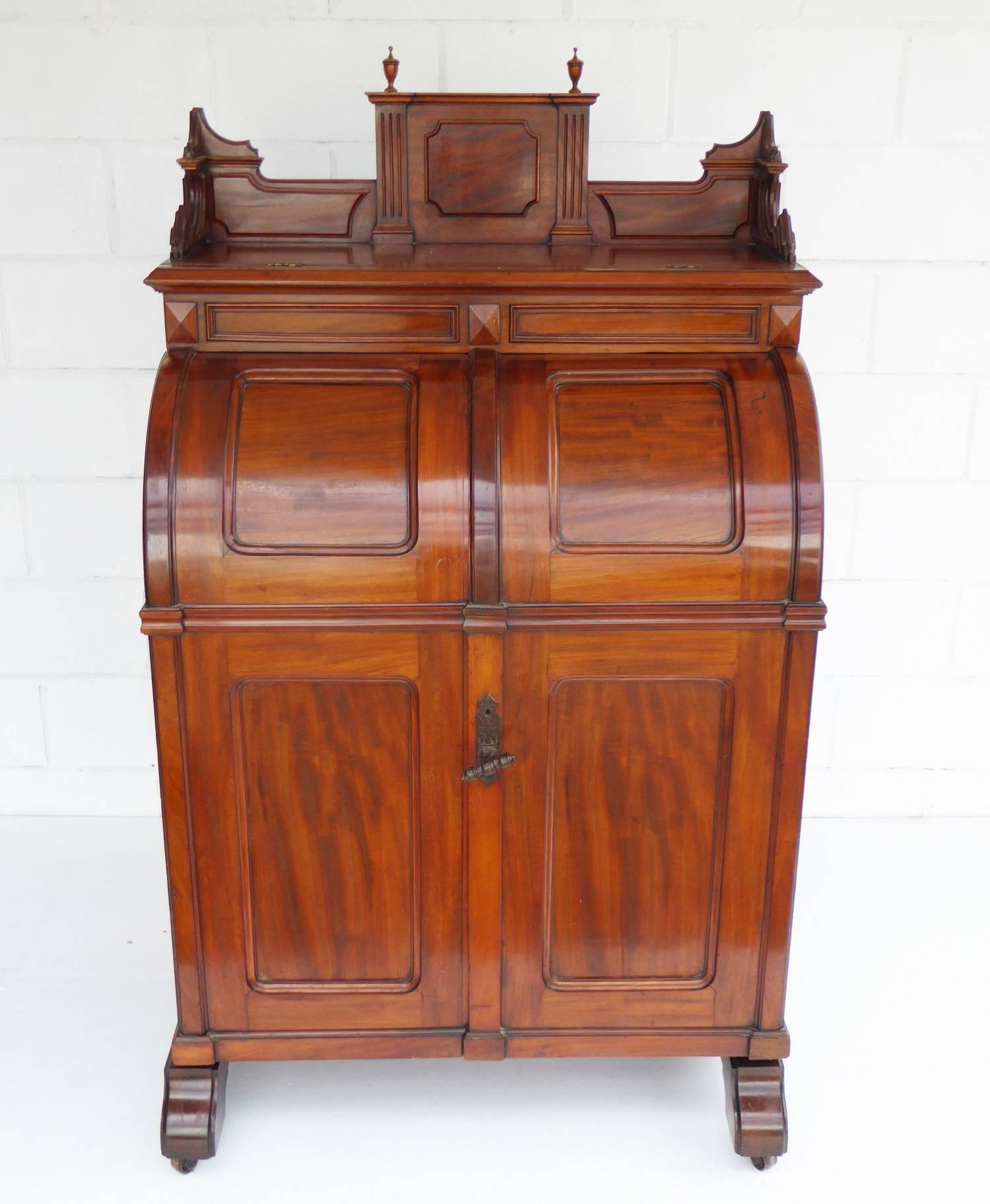 Selling is a rare American Wooton desk ,the desk when opened reveals a pull down writing fall ,this when opened reveals four small drawers several small and large pigeon holes ,below the fall it has four larger drawers and several more spaces for