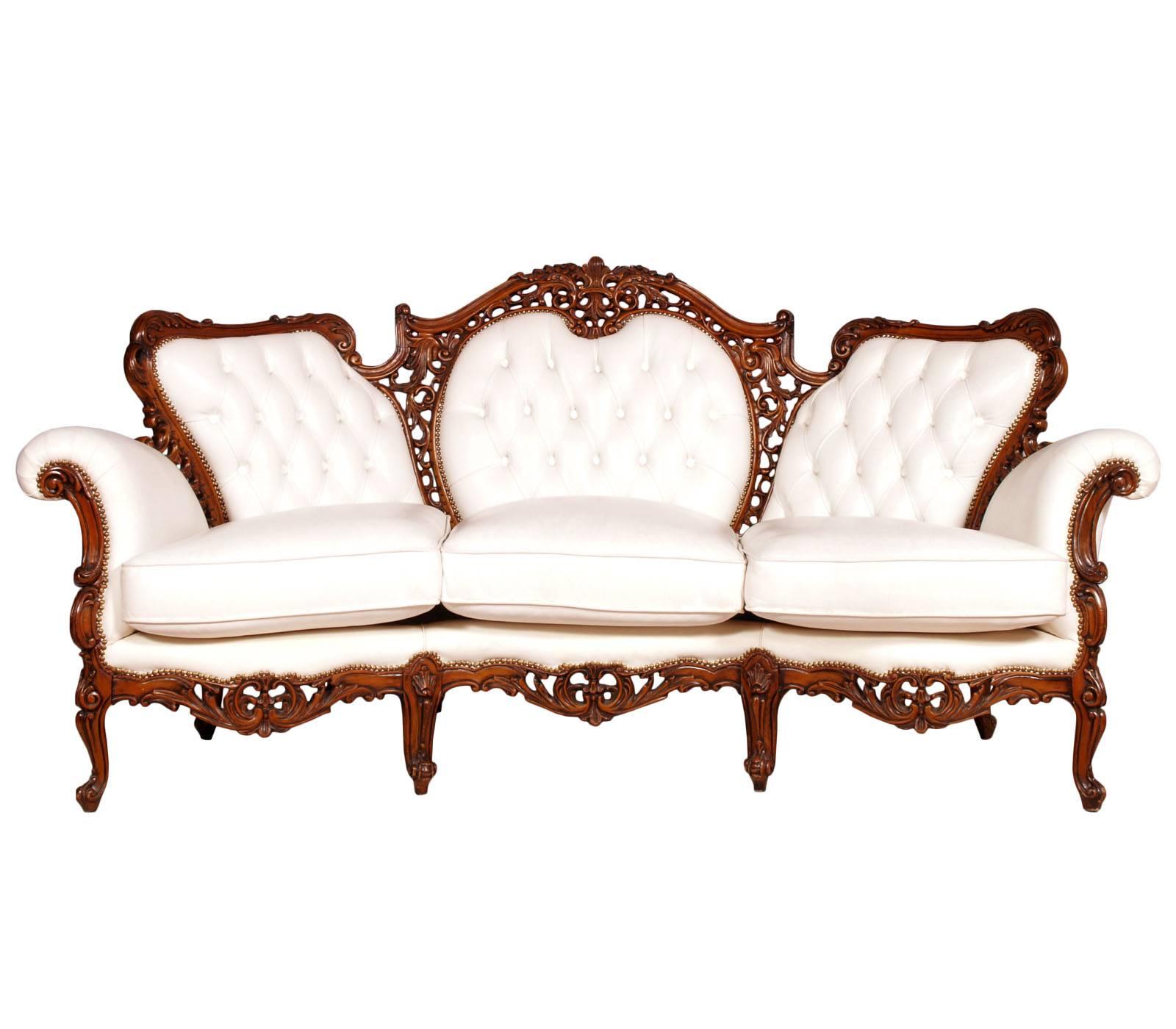 Early 20th Century Venetian Rococò armchairs and sofa by Atelier Cadorin Venice in hand-carved walnut and leather upholstered, wax polished
All the padding has been replaced with high quality material
We can sell the armchairs and the sofa