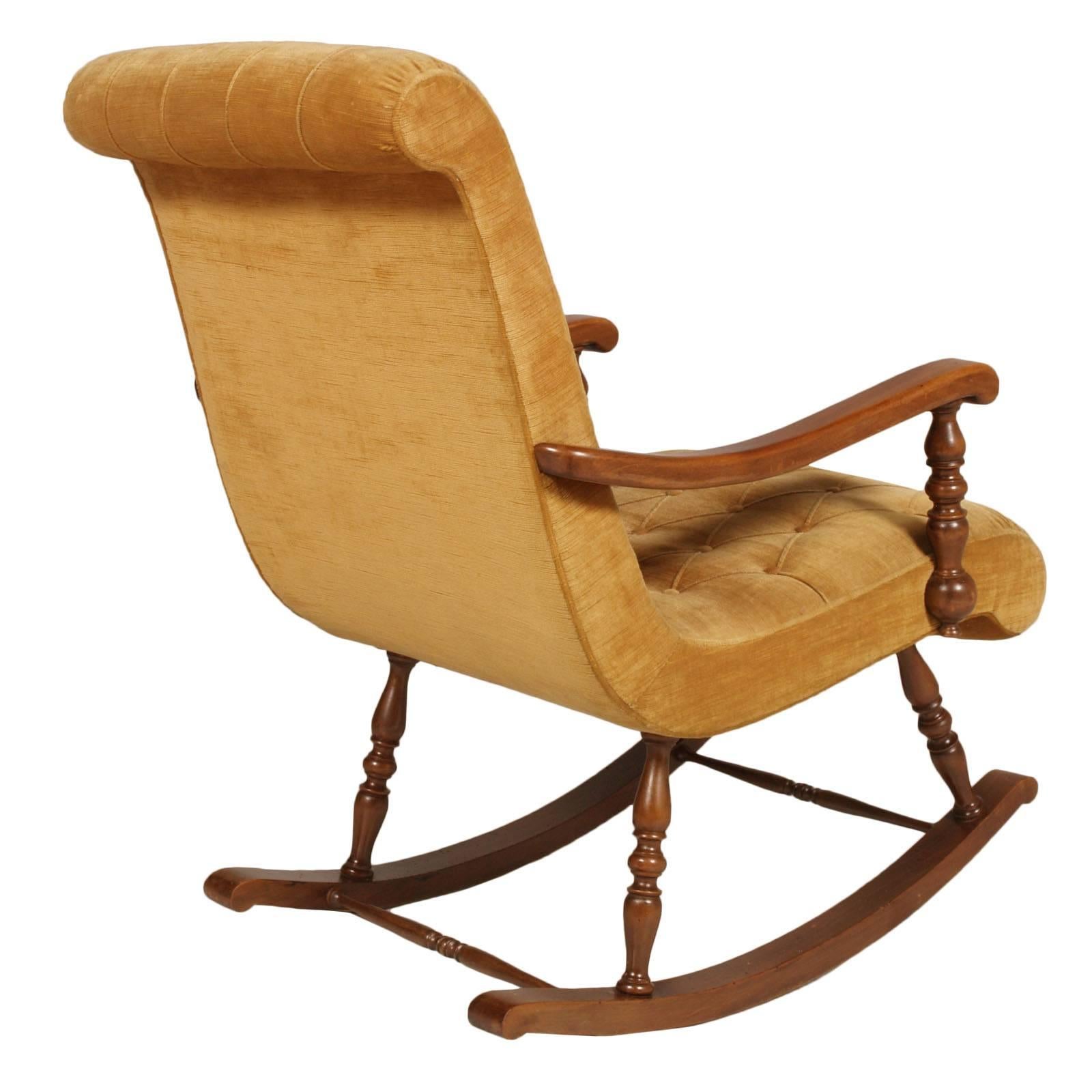 Code: FS93
Midcentury Modern Italian rocking chair with molded and shaped walnut frame;
upholstered with original velvet capitonnè. 

 