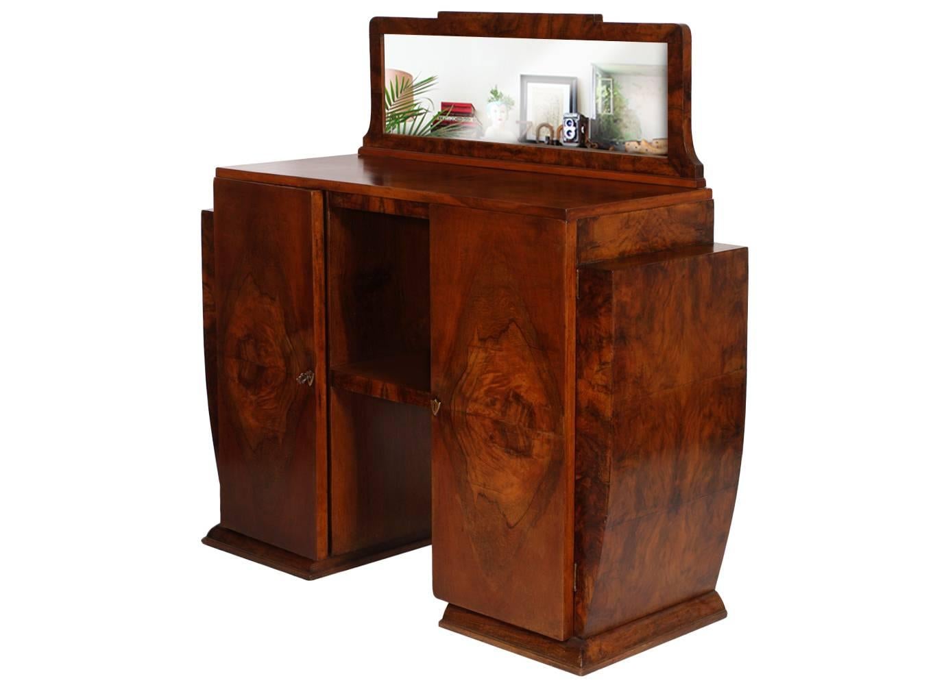 Code: FP07
Sculptural All original Art Deco Gaetano or Osvaldo Borsani credenza , sideboard or console early 20th century in walnut and burr walnut. Small rectangular shaped mirror. Two doors with interior shelf. 
Restored and polished with wax.