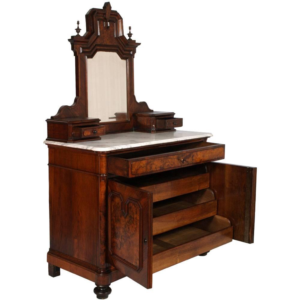 Code: FI58

Neoclassic  dresser in solid walnut and burl walnut of the mid nineteenth century with two doors. Table mirror with two small side drawers. Top in white marble of Carrara shaped and terminated beak of  owl. Ample drawer and two doors