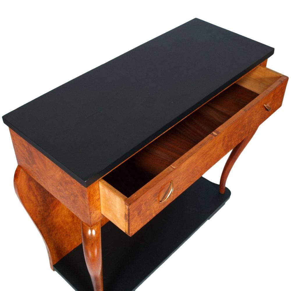 Console Art Deco by Atelier di Varedo, by  Gaetano & Osvaldo Borsani in blond walnut and burl walnut veneer. Top and bottom black ebonized. Wide drawer with original handles of the period. Elegant wood legs turned to horn. Wax polished.

Measures
