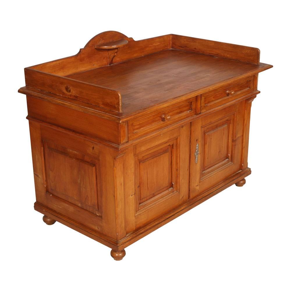 Antique country Tyrol credenza sideboard in solid larch of late 19th century. Restored and wax polished
It is ideals olso as washbasin cabinet in a modern bathroom 

Measures cm: H 87 W 110 D 62 