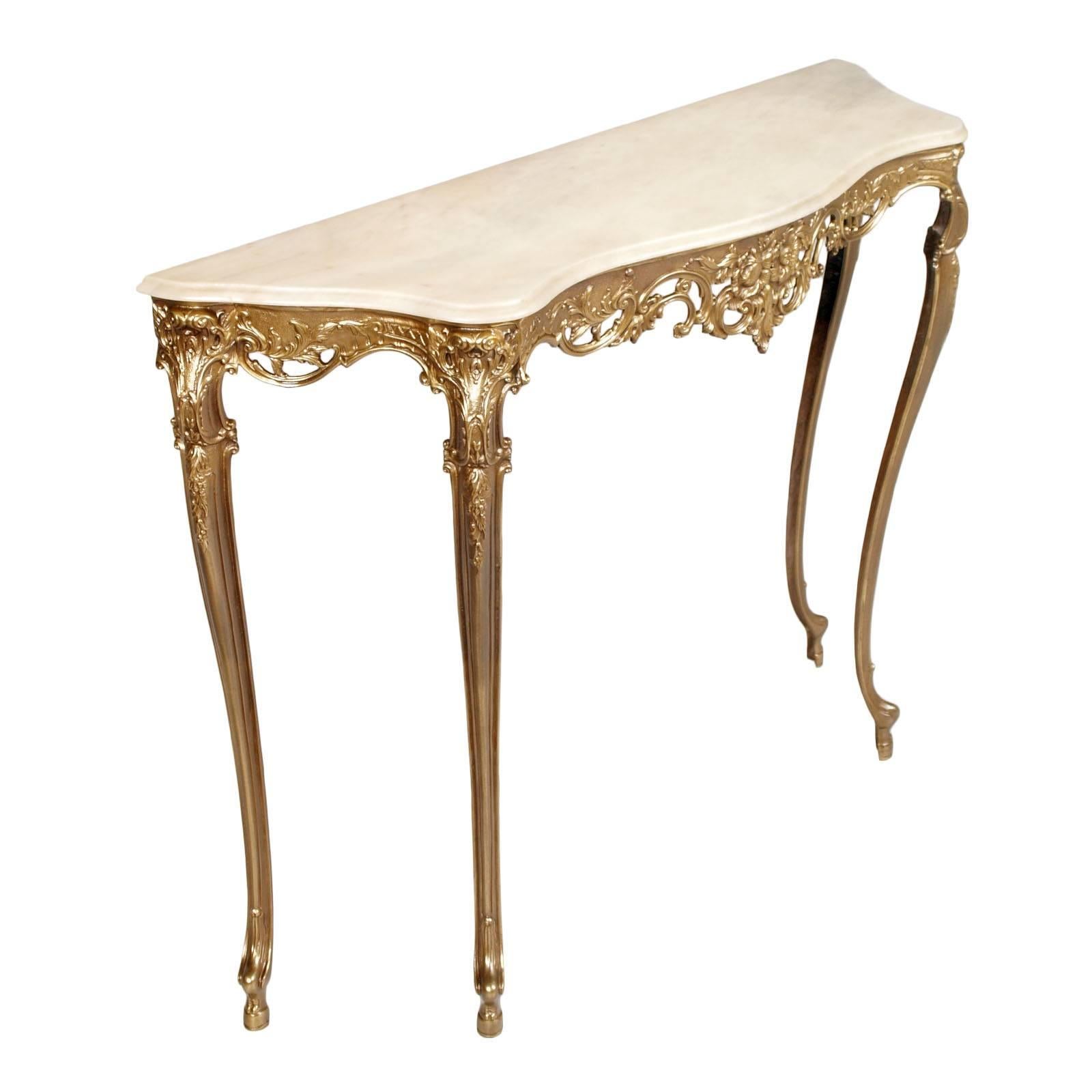 Refined Venetian console in molten bronze, burnished, clear top in onyx.

Measure cm: H 81, W 110, D 32.