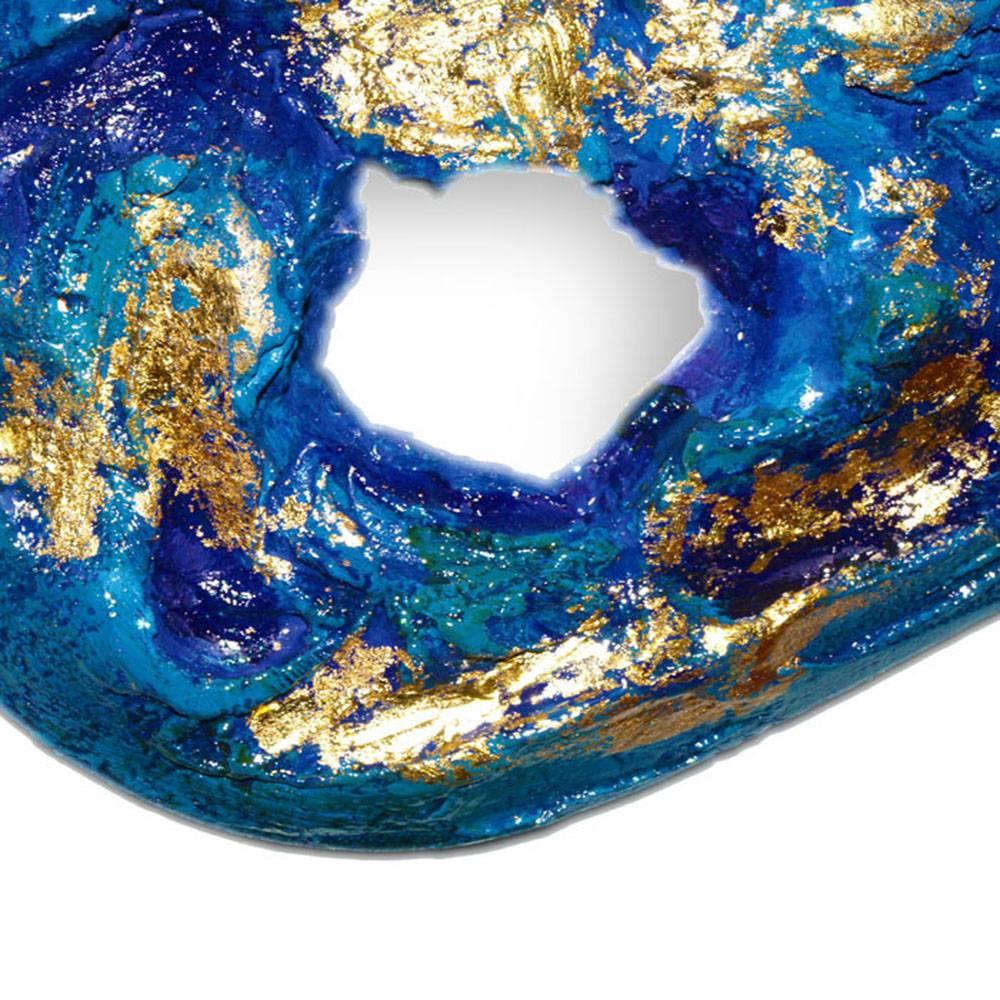 Antique modernism mirror, conglomerate and stucco, lacquered blue sea and gold leaf, with some particular rocky bottom. The effect of the mirror when illuminated is very beautiful and creates a sea effect with shades of blue to turquoise, glitter to