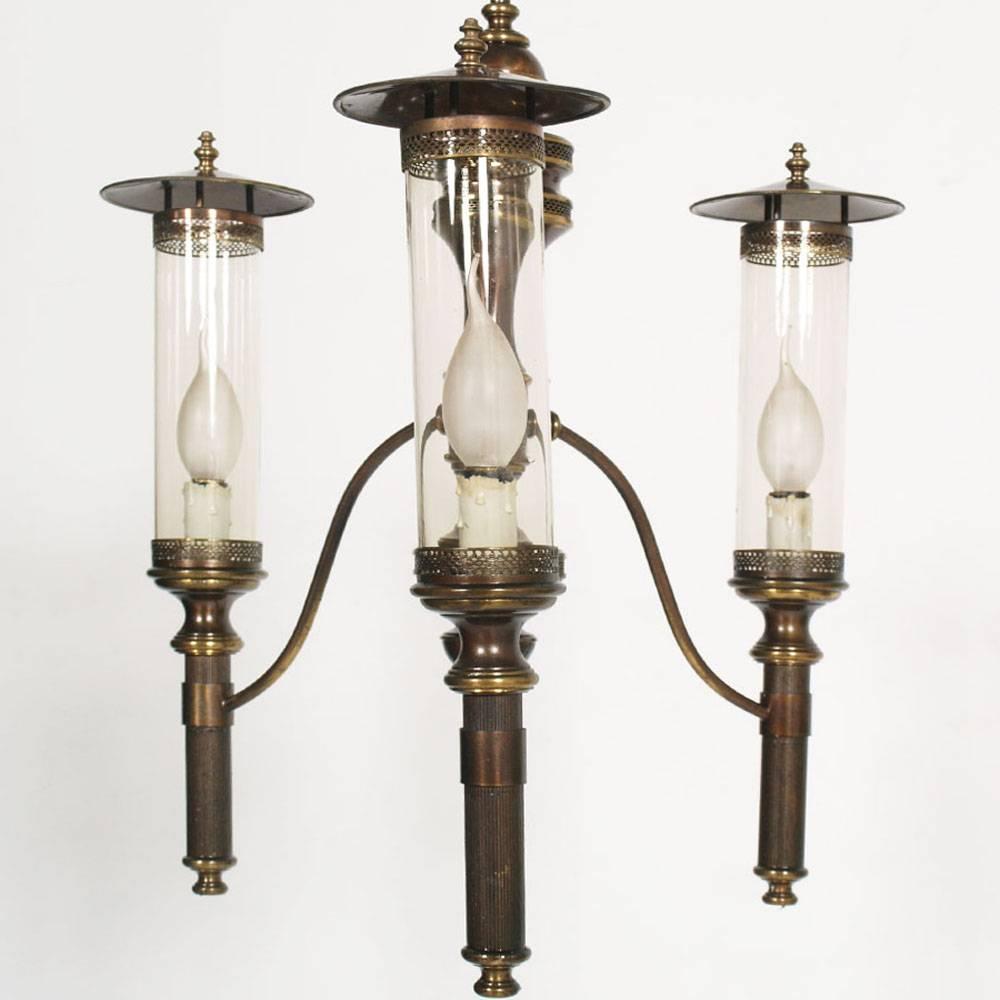 Art Deco chandelier with sconces in burnished brass, overhauled electrical system in perfect condition
We can sell the chandelier separately from the two sconces

Measures in cm: 
chandelier H 105 Diam 46 
sconce       H 45 Diam 15

