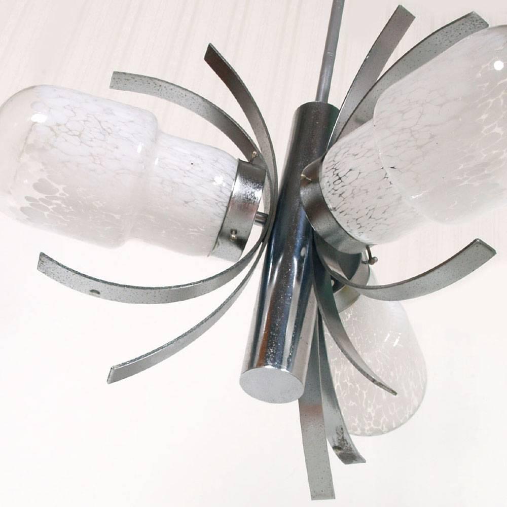 1960s Chandelier with thee lights , in chromed steel and Murano glass , model explosion by Mazzega
Bowl Murano glass lattimo, gradually transparent at the top.
Ready-to-use renewed electrical system.

Measures cm: H 80 D. 55.