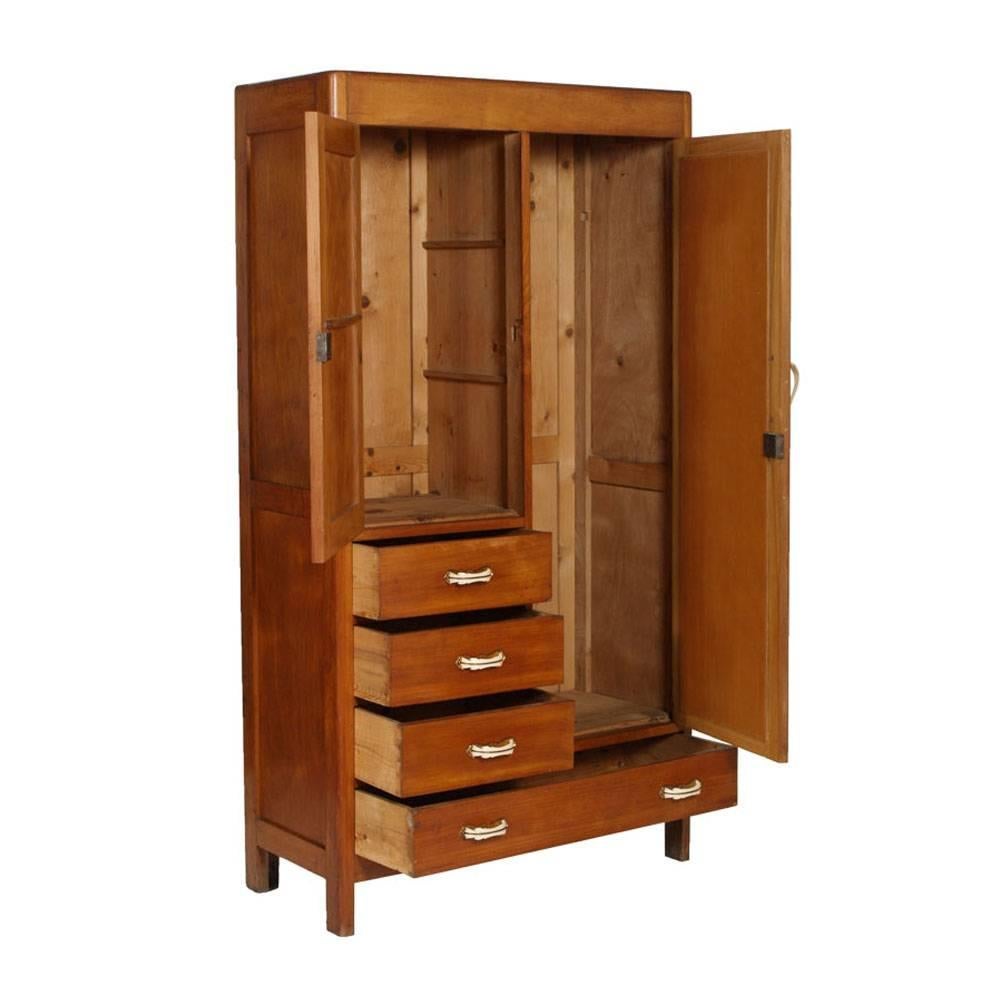 A very useful piece of furniture that solves the problem of the wardrobe and chest of drawers.
Mirror in the high door, and burl applied with threaded inserts characteristic of the period in the smaller door. Original handles and original