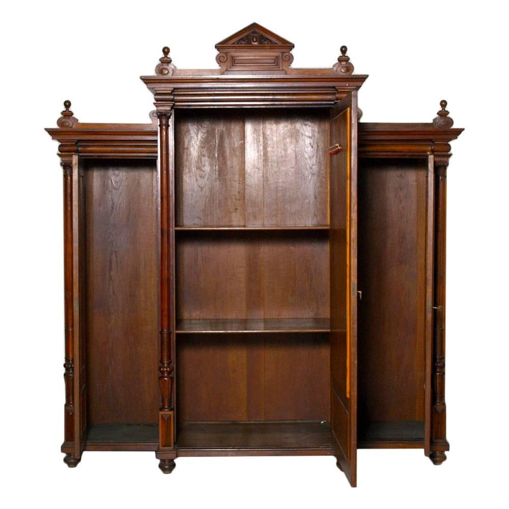 Italian last 19th century neoclassic wardrobe bookcase, all solid walnut and burl walnut and solid oak interior. Restored and polished to wax.
Elegant and sturdy wardrobe can also be used as an important bookcase.

Measures cm: H 234 x W 247 x D