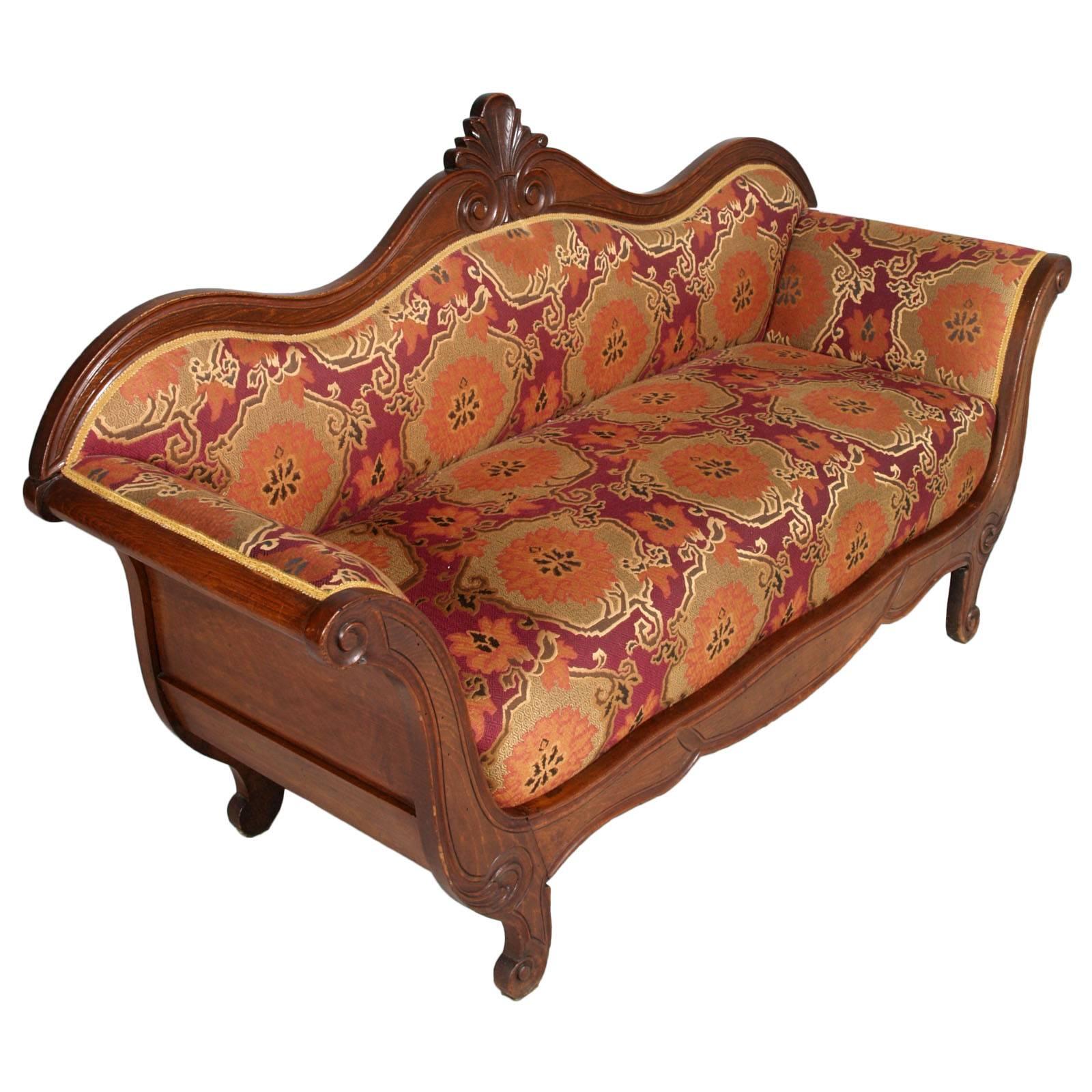 Precious mid-19th century Venetian sofa attributable to Valentino Panciera Besarel in hand-carved walnut, restored and finished to wax. Coated with precious original Venetian brocade fabric of the deco period; includes a sofa cover of the same