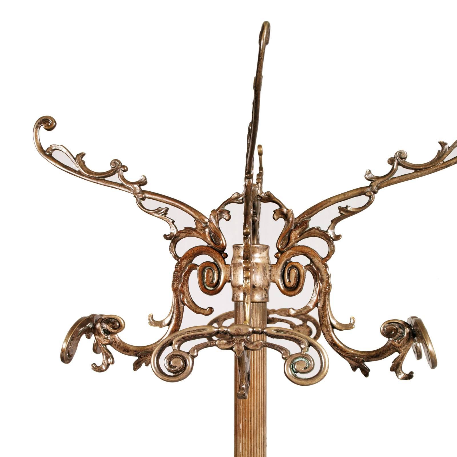 Bronze and brass burnished Art Nouveau Belle Époque Hanger with Grifone feet in molten bronze.
Glamorous figures and volute characteristics of the Belle Époque period

Measures cm: H 175 x D. 55.