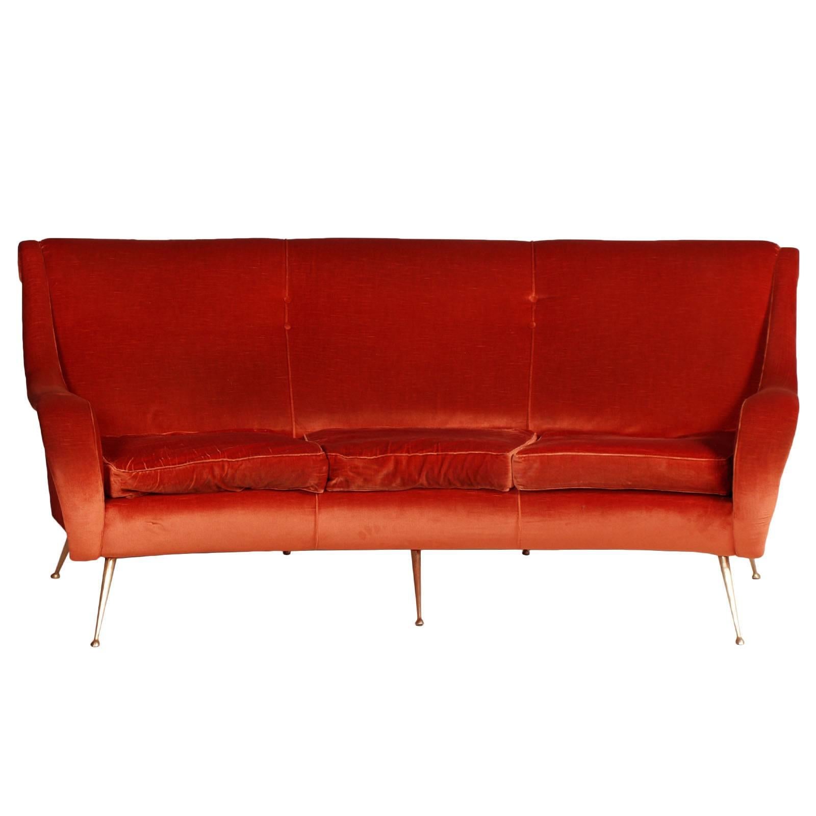 Elegant Italian Three-seat curved sofa Marco Zanuso design, golden legs, original red coral velvet and foam in very good condition, still usable. The velvet has been sanitized and has no obvious signs of wear.
With 1500 euros, on request we can