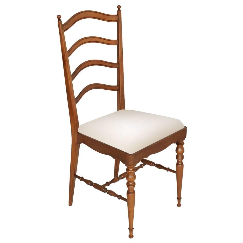 Elegant and robust set of four Mid-Century modern dining Chiavari chairs, in blond walnut with new white upholstery . Manufactured in the city of Chiavari on the Ligurian coast of Italy, created, circa 1960s. Excellent conditions
Measure cm: H