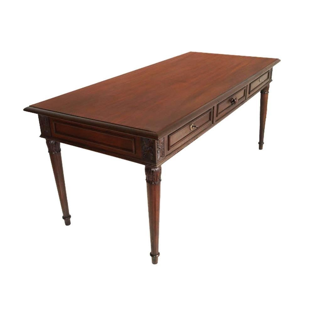 Three drawers 1910s neoclassic  table or writing desk in carved walnut , polished to wax

Measures cm: H 80, W 185, D 82.