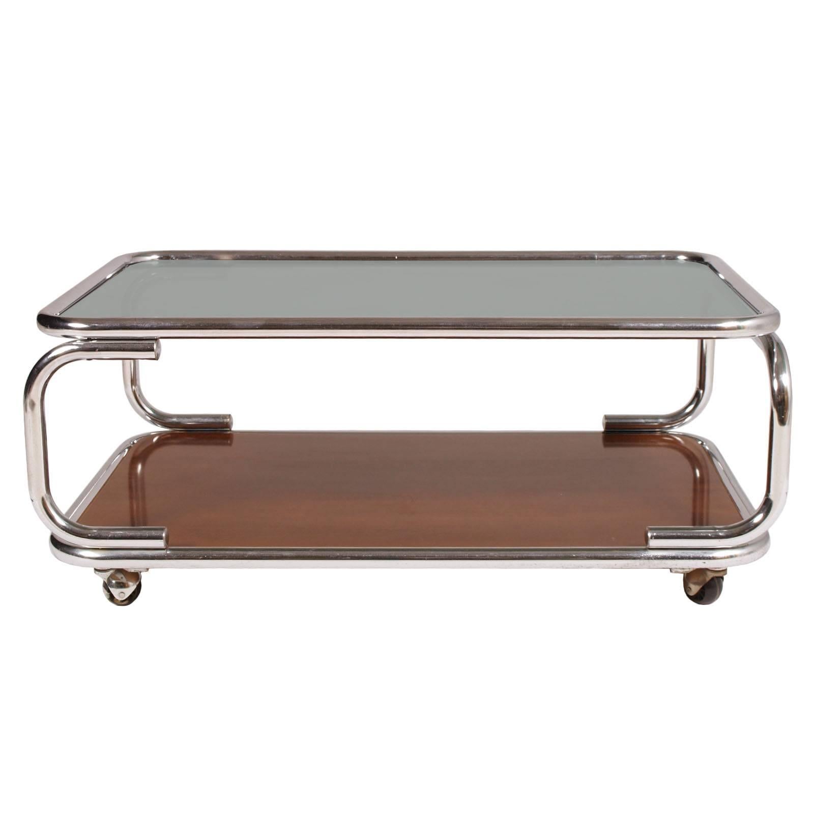 Mid-Century Modern Italy chrome serving trolley or coffee table, with smoked glass top with under faux laminated wood.