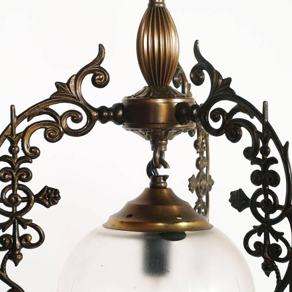 Early 20th century chandelier Art Nouveau burnished bronze and brass with spherical opaline blown lamp Murano glass
Electrical system redone and working.

Measure cm: Height 60, diameter 30.