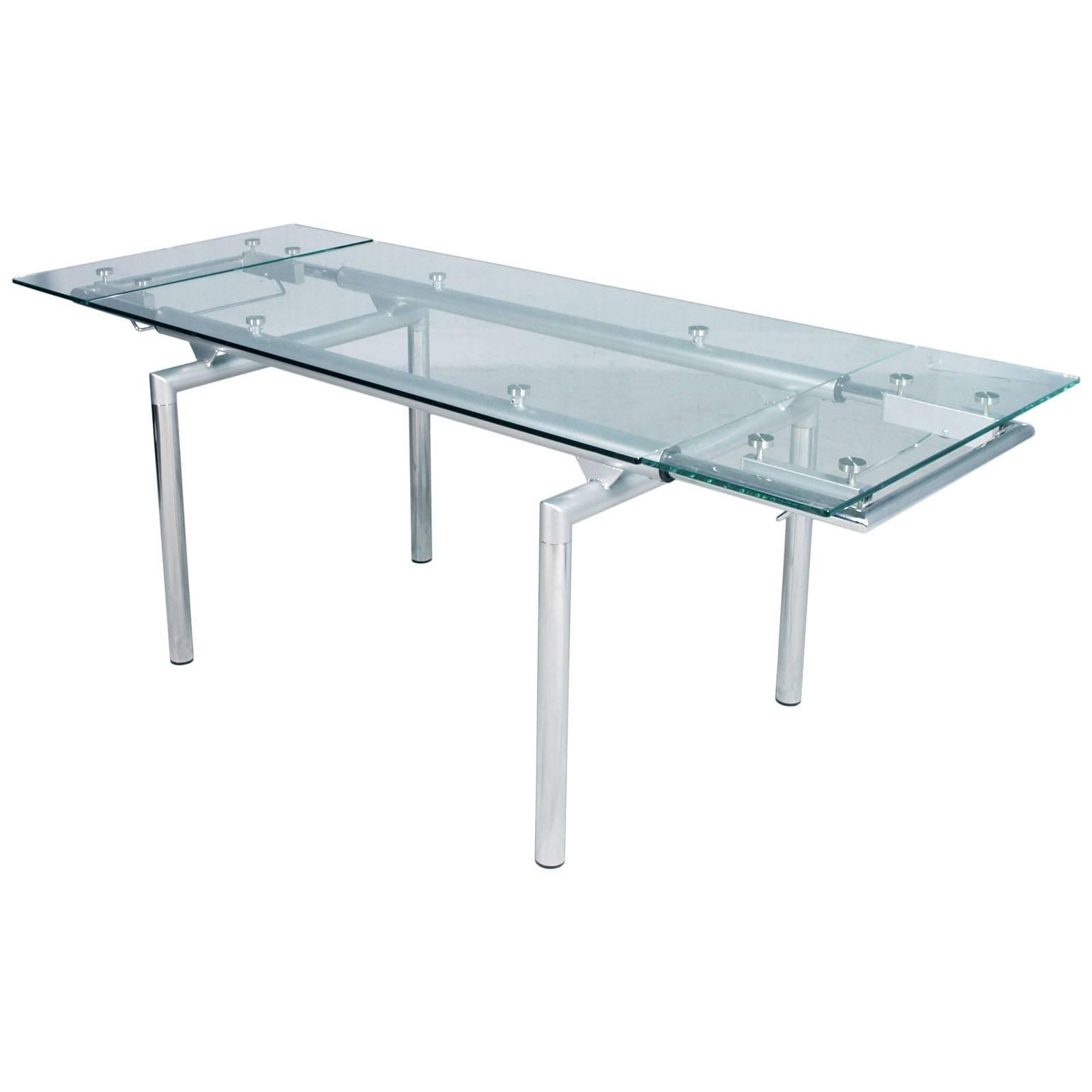 Italian 1980s chromed and crystal extensible Tecno-table, Le Corbusier style.
Produced by Tecno SpA based on a Norman Foster project
The two extendable parts can be moved with a manually operated cylinder mechanism with an eccentric device for the