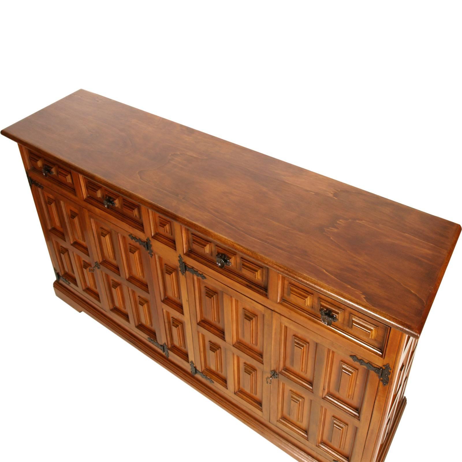 Midcentury Italian Renaissance credenza cupboard from Bassano  in solid walnut polished to wax.

This style of furniture has been widely used in Italy in the the country houses, from the 1930s to the 1970s, with the name of 